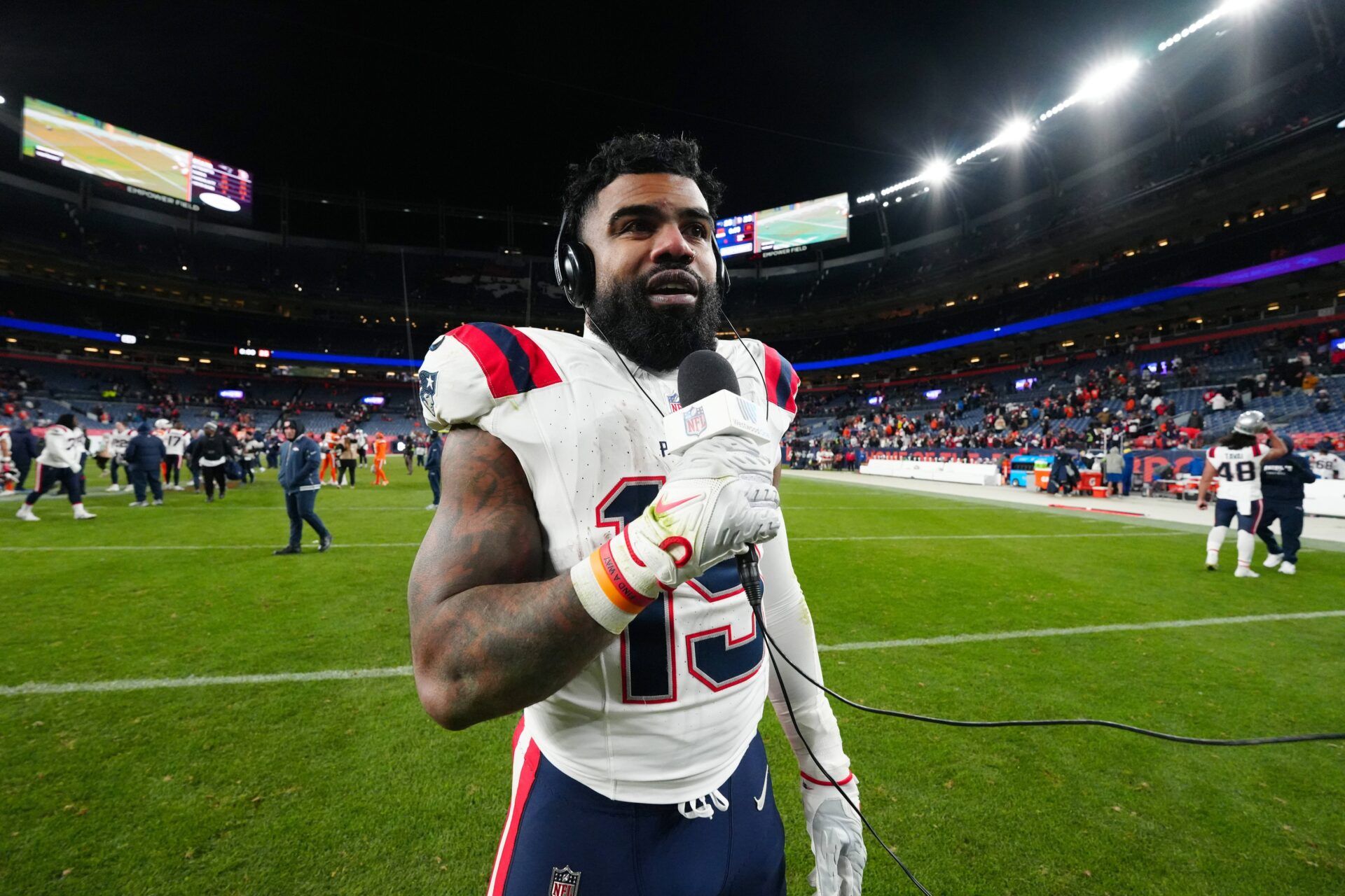 Dec 24, 2023; Denver, Colorado, USA; New England Patriots running back Ezekiel Elliott (15) following the win over the Denver Broncos at Empower Field at Mile High. Mandatory Credit: Ron Chenoy-USA TODAY Sports