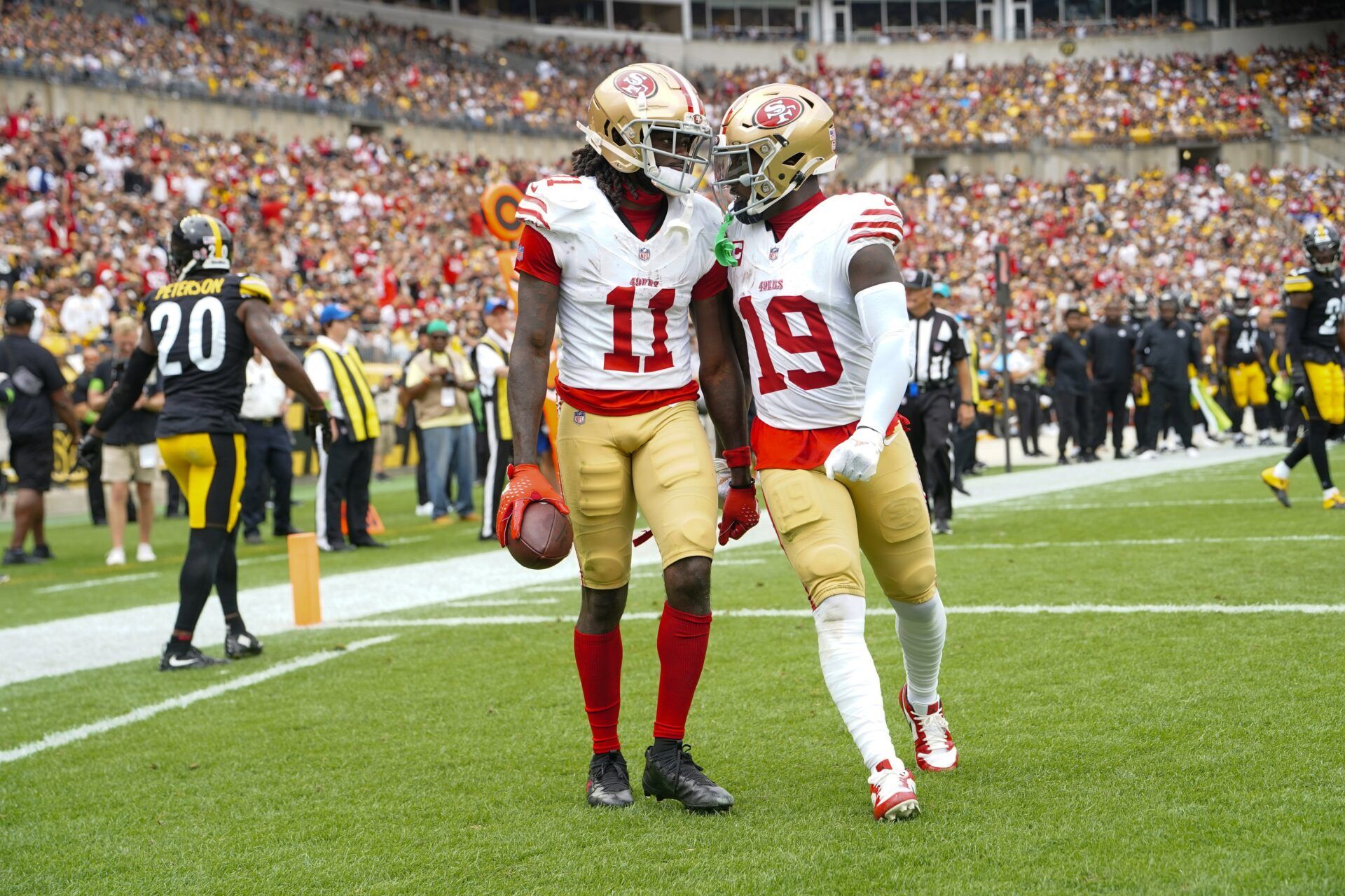 Sep 10, 2023; Pittsburgh, Pennsylvania, USA; San Francisco 49ers wide receiver Deebo Samuel (19) congratulates San Francisco 49ers wide receiver Brandon Aiyuk (11) for catching a touchdown pass against the Pittsburgh Steelers during the first half at Acrisure Stadium. Mandatory Credit: Gregory Fisher-USA TODAY Sports