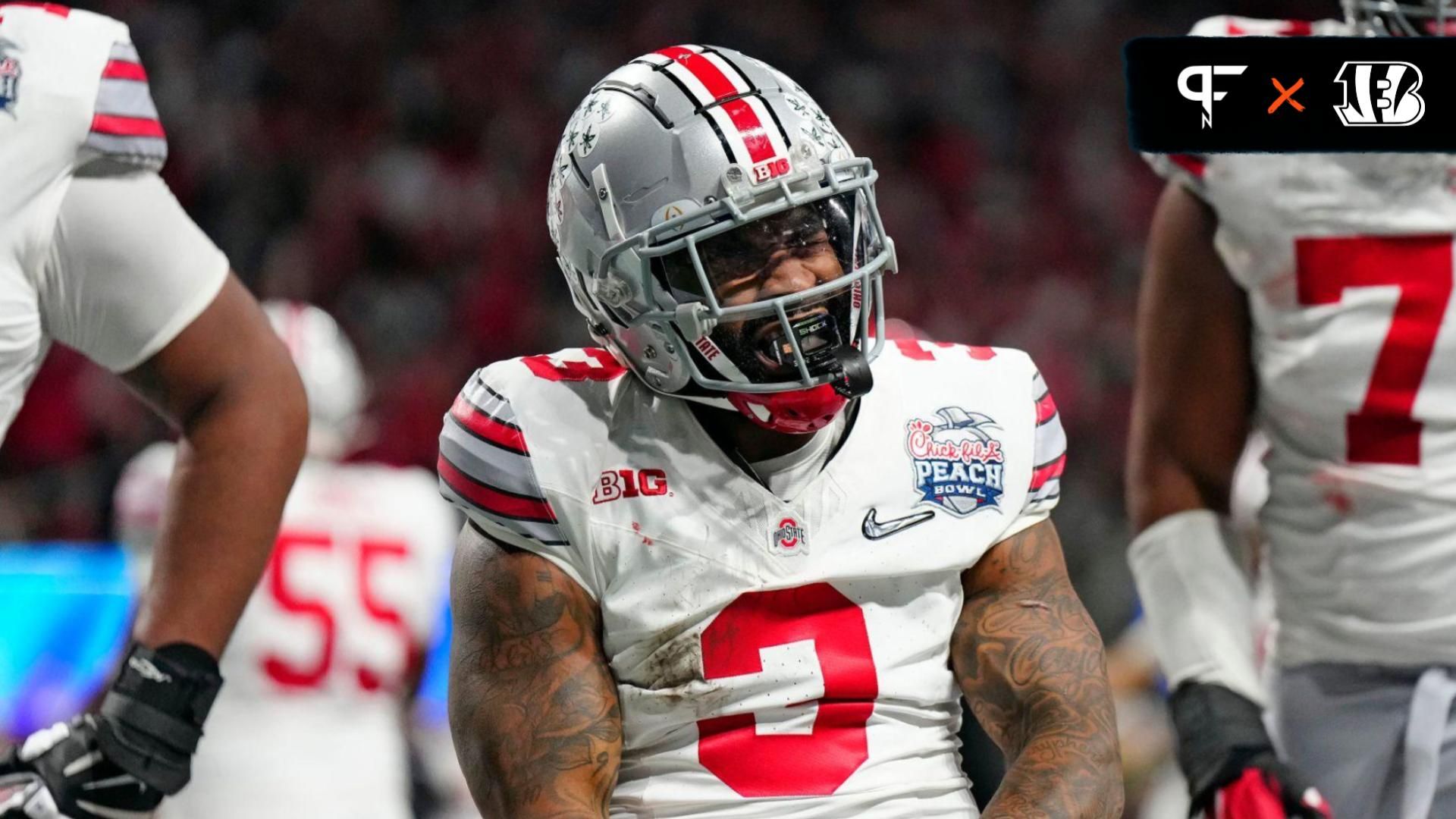 Ohio State Buckeyes running back Miyan Williams (3) celebrates a rushing touchdown against Georgia Bulldogs during the second quarter of the Peach Bowl in the College Football Playoff semifinal at Mercedes-Benz Stadium.