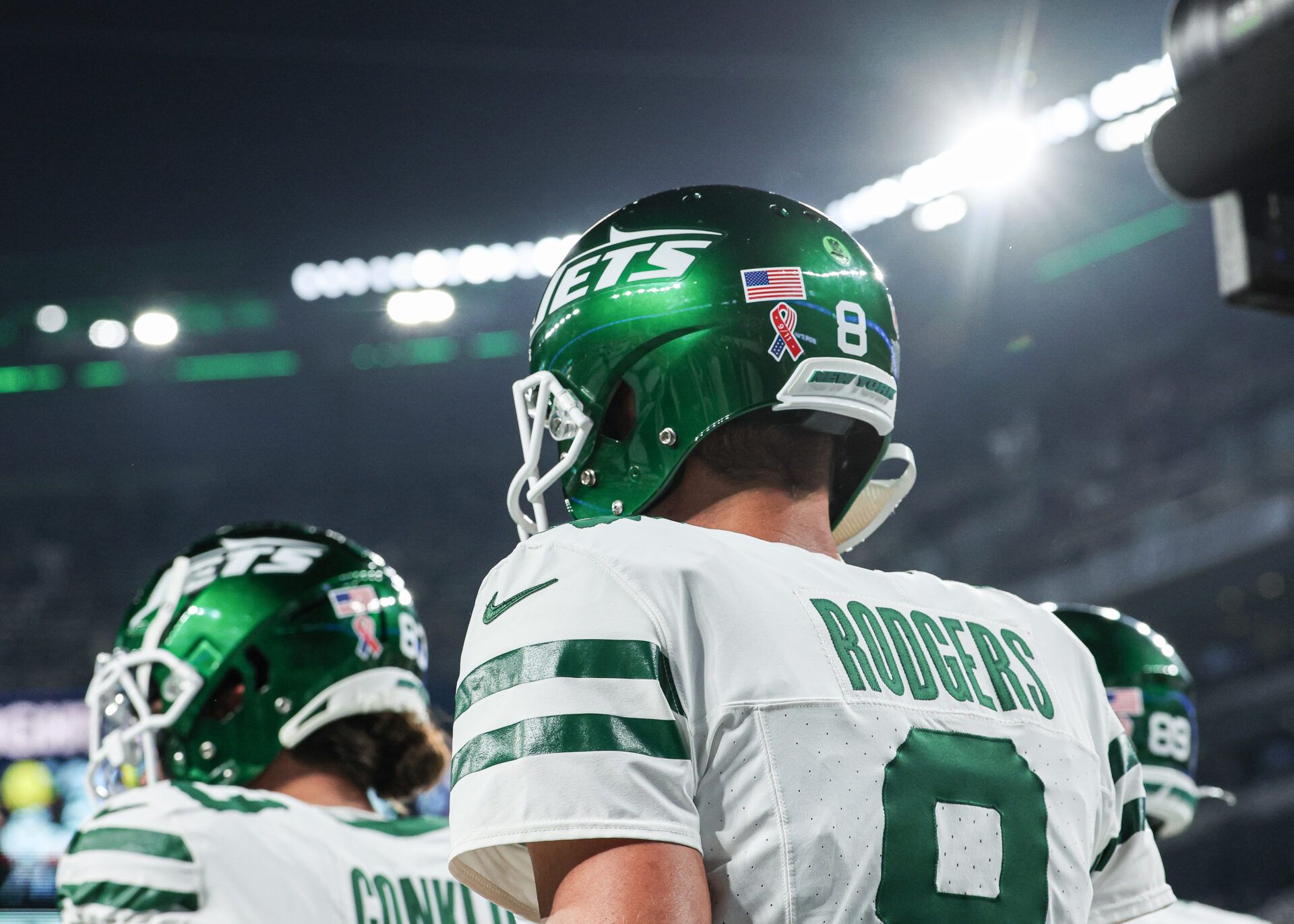 New York Jets quarterback Aaron Rodgers (8) walks on the field at MetLife Stadium before the game against the Buffalo Bills.