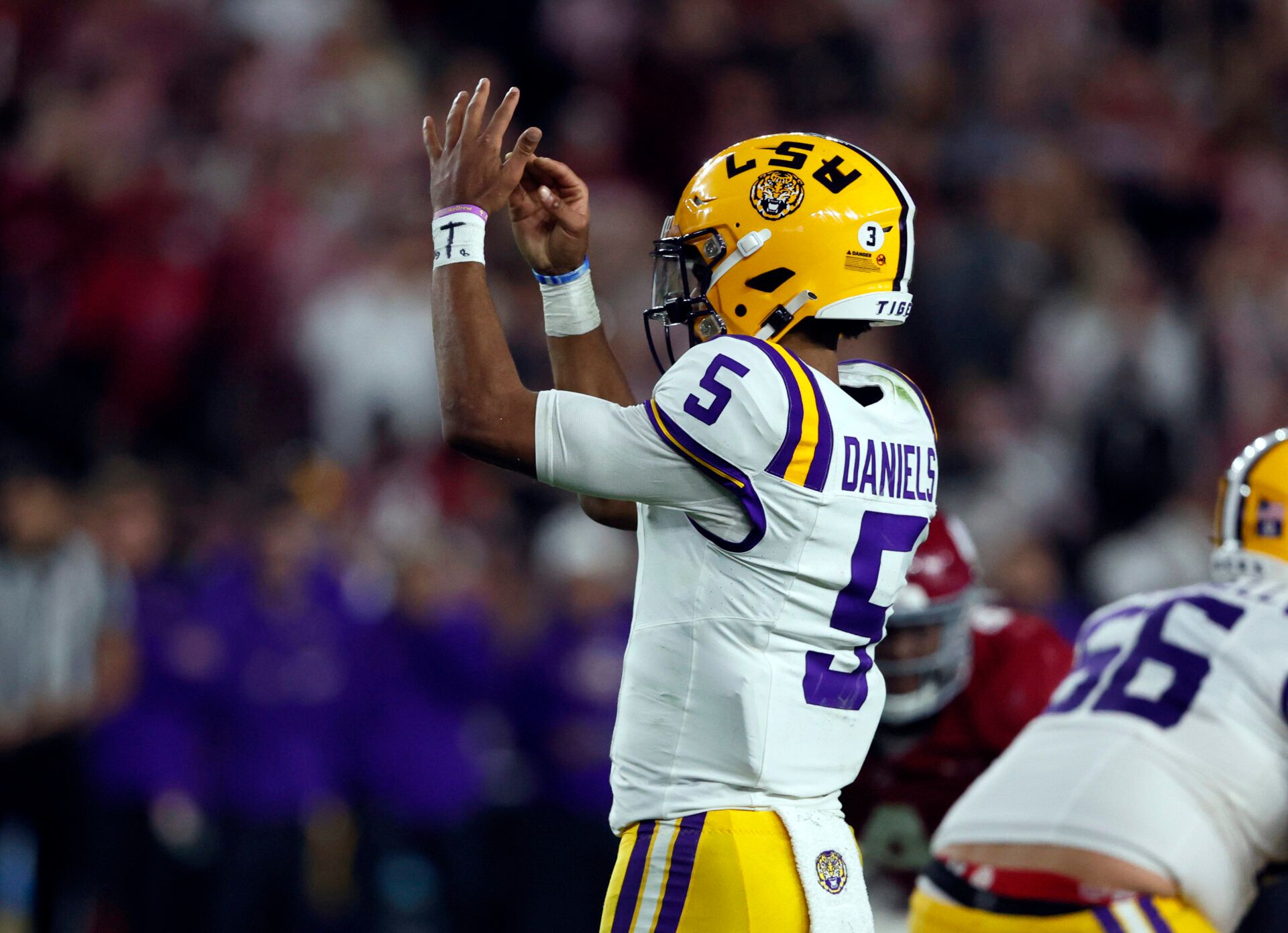 LSU Tigers quarterback Jayden Daniels (5) calls a timeout and left the game during the second half at Bryant-Denny Stadium.