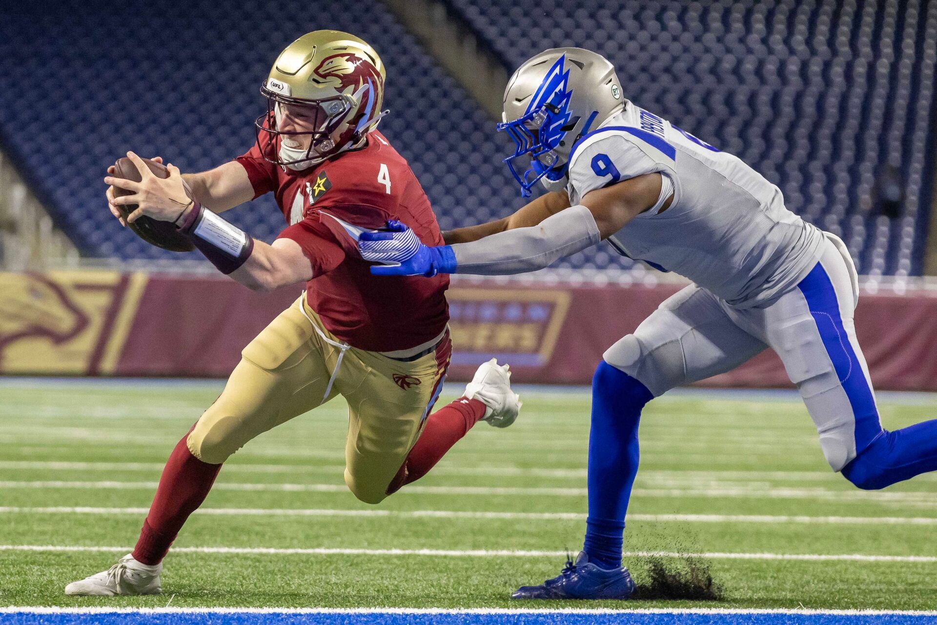 Michigan Panthers quarterback E.J. Perry (4) scores a touchdown against the St. Louis Battlehawks during the second half at Ford Field.