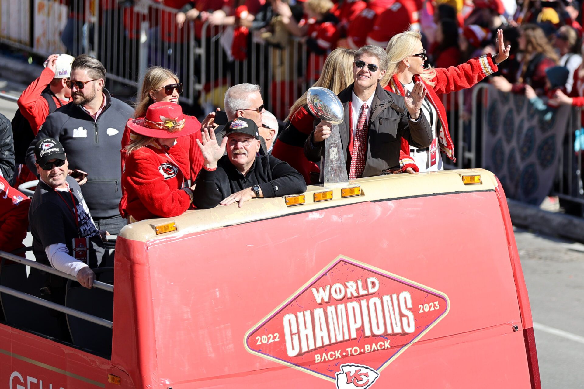 Kansas City Chiefs head coach Andy Reid and owner Clark Hunt celebrate with the Vince Lombardi Trophy in the parade during the celebration of the Kansas City Chiefs winning Super Bowl LVIII.