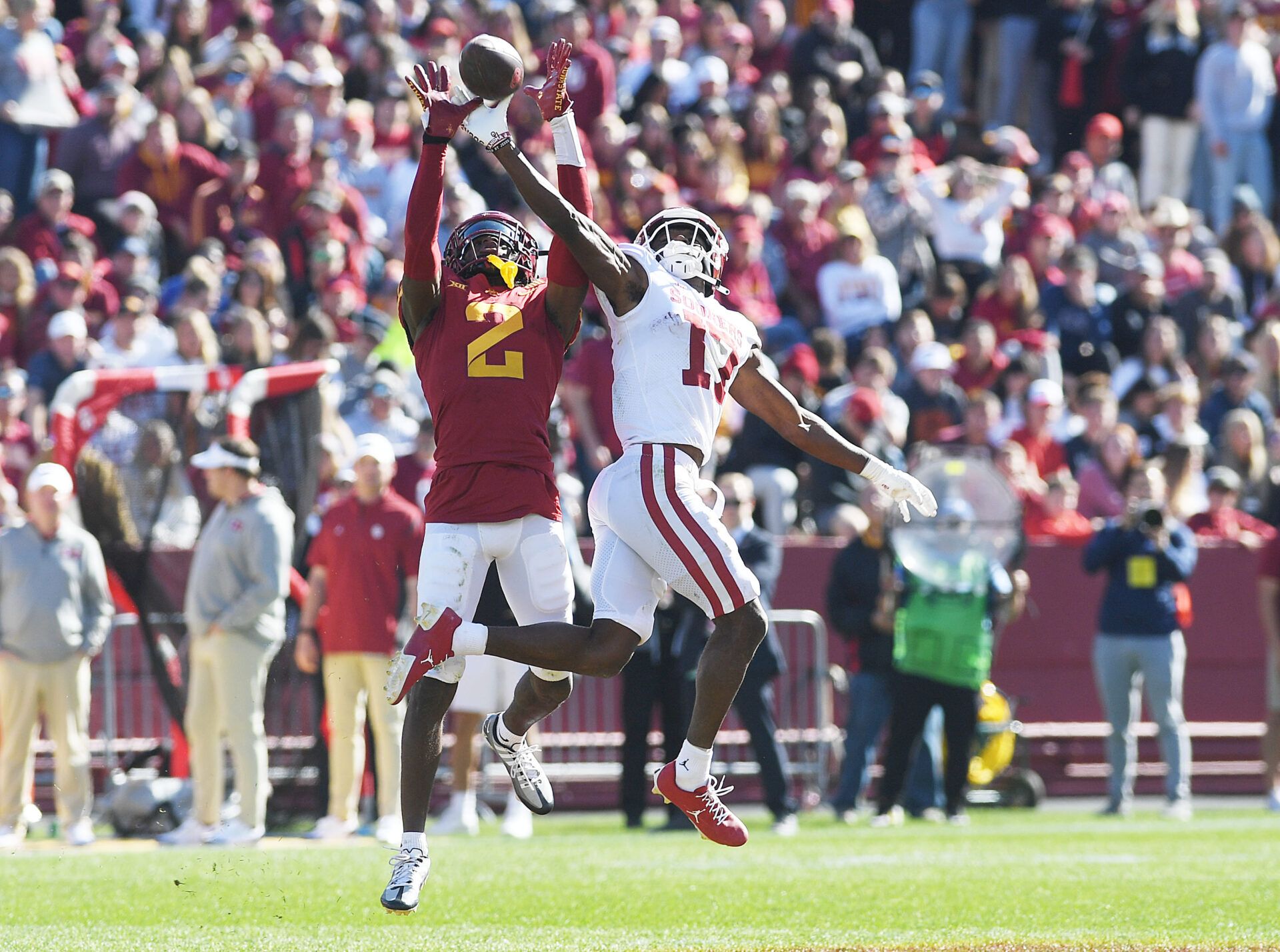 Iowa State Cyclones defensive back T.J. Tampa (2) knocks out the ball from from Oklahoma Sooners wide receiver Marvin Mims Jr. (17) during the third quarter in the Big 12 Conference game at Jack Trice Stadium.