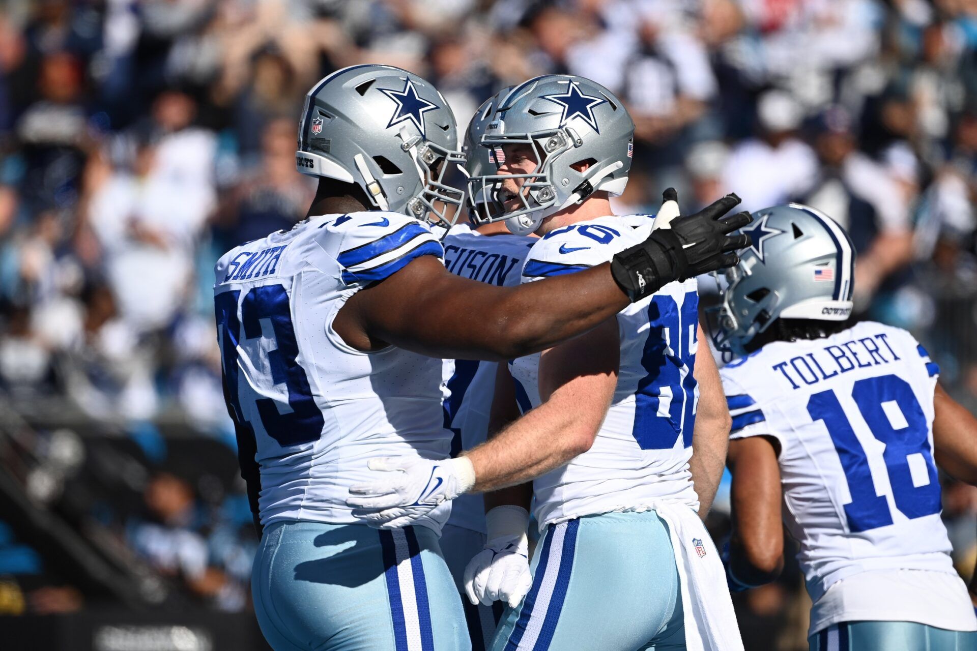 Dallas Cowboys tight end Luke Schoonmaker (86) celebrates with offensive tackle Tyler Smith (73) after scoring a touchdown in the first quarter at Bank of America Stadium.