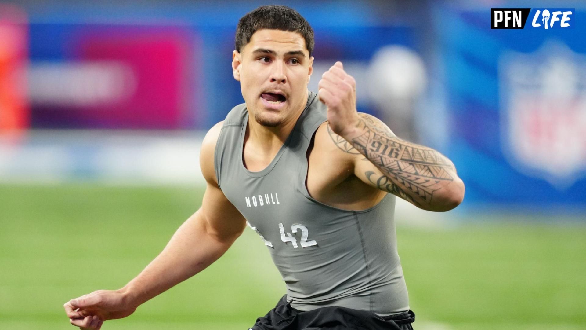 UCLA defensive lineman Laiatu Latu (DL42) works out during the 2024 NFL Combine at Lucas Oil Stadium.