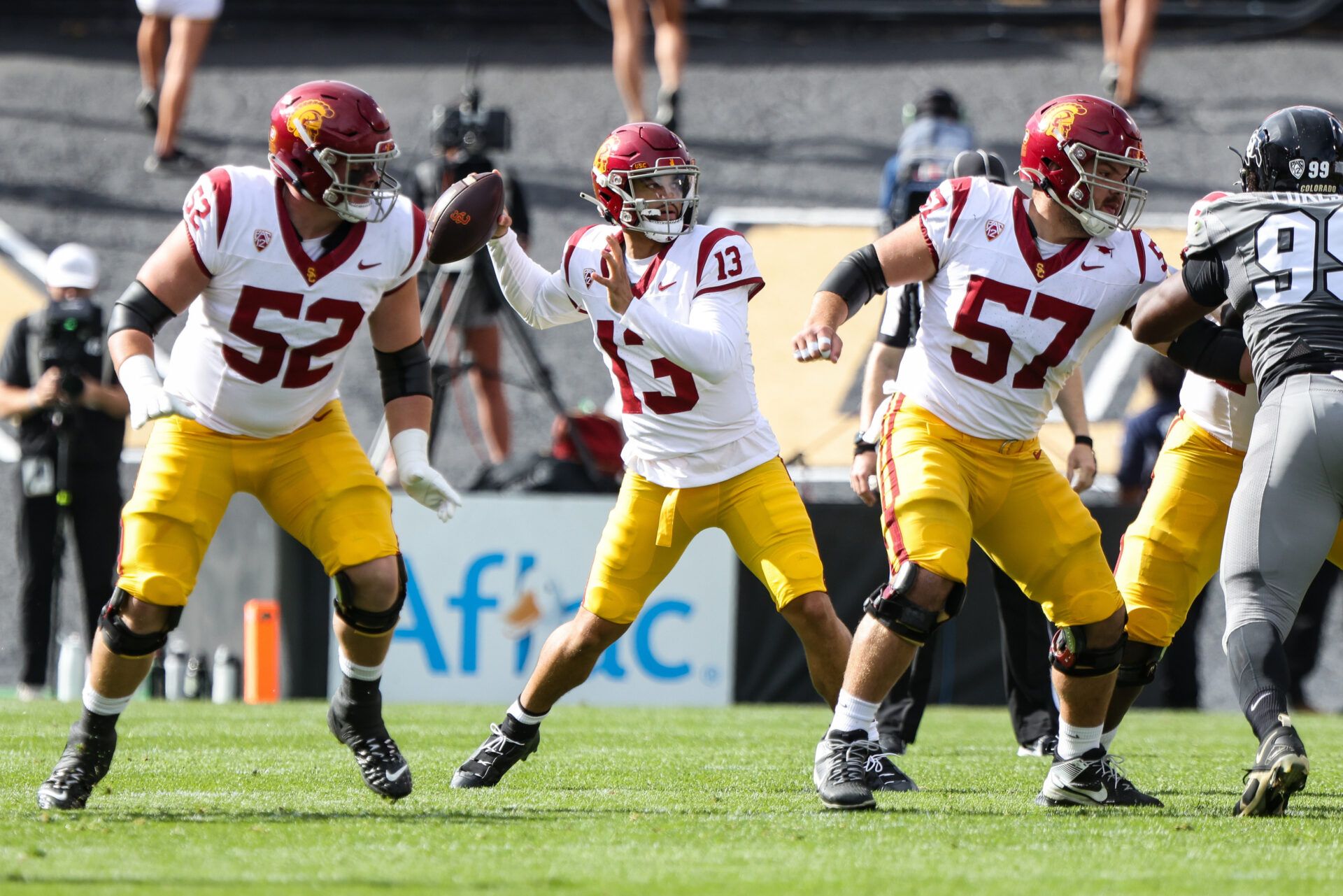 USC Trojans quarterback Caleb Williams (13) drops back to pass during the first quarter of the game against the Colorado Buffaloes at Folsom Field.