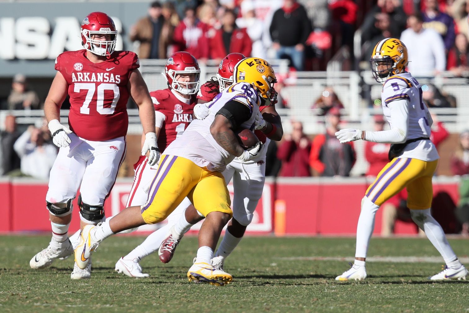 LSU Tigers defensive lineman Mekhi Wingo (92) recovers a fumble in the fourth quarter against the Arkansas Razorbacks at Donald W. Reynolds Razorback Stadium. LSU won 13-10.