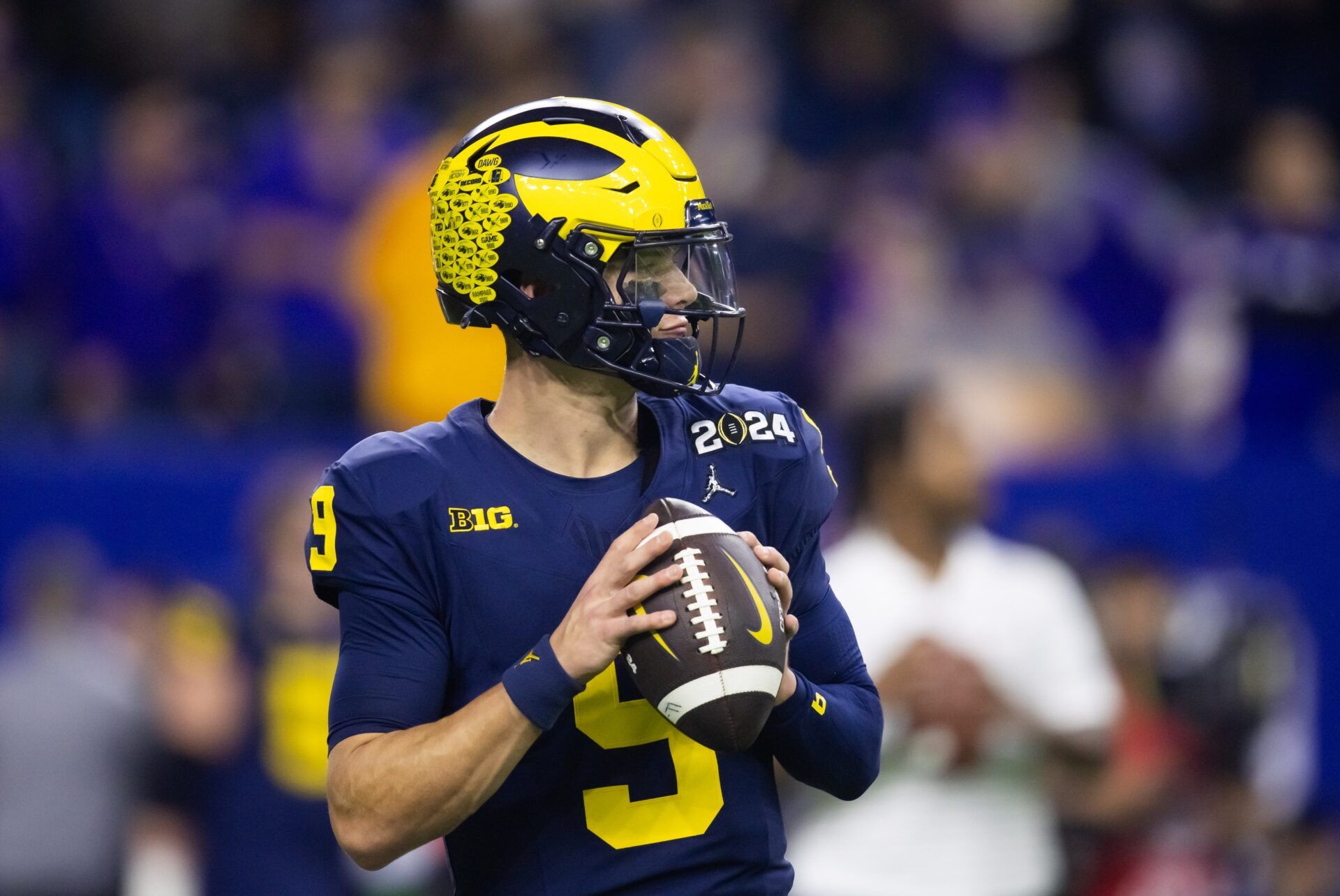 Michigan Wolverines quarterback J.J. McCarthy (9) against the Washington Huskies during the 2024 College Football Playoff national championship game at NRG Stadium.