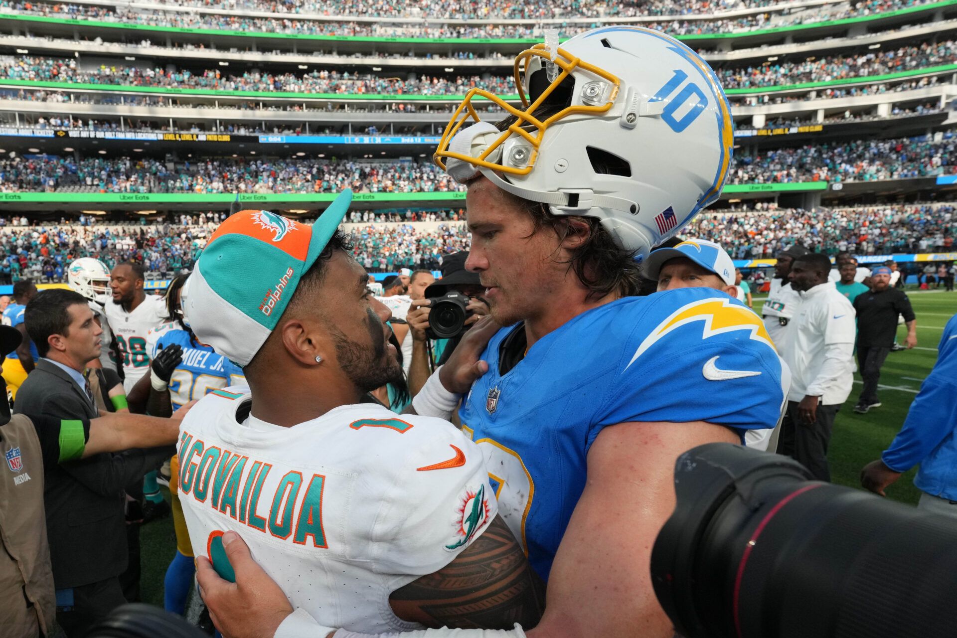 Sep 10, 2023; Inglewood, California, USA; Miami Dolphins quarterback Tua Tagovailoa (1) and Los Angeles Chargers quarterback Justin Herbert (10) shake hands after the game at SoFi Stadium. Mandatory Credit: Kirby Lee-USA TODAY Sports