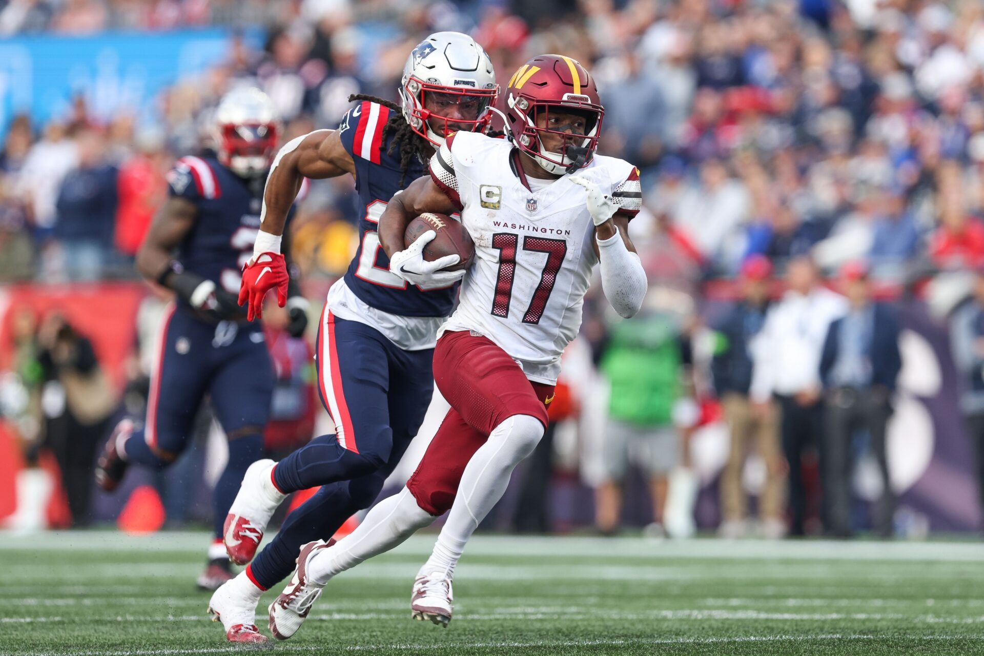 Washington Commanders receiver Terry McLaurin (17) runs the ball during the second half against the New England Patriots at Gillette Stadium. Mandatory Credit: Paul Rutherford-USA TODAY Sports