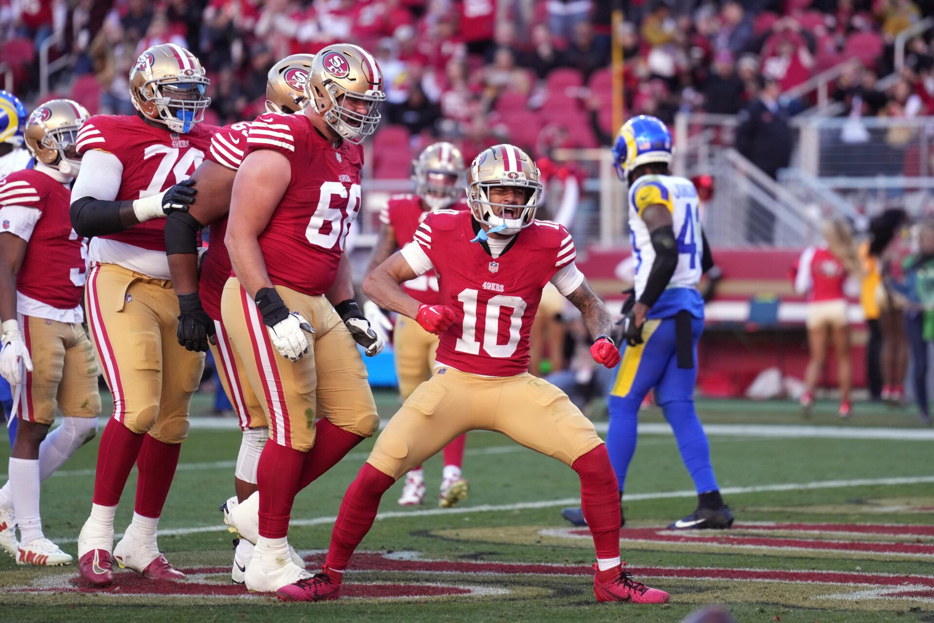 San Francisco 49ers wide receiver Ronnie Bell (10) celebrates after catching a touchdown pass against the Los Angeles Rams during the second quarter at Levi's Stadium.