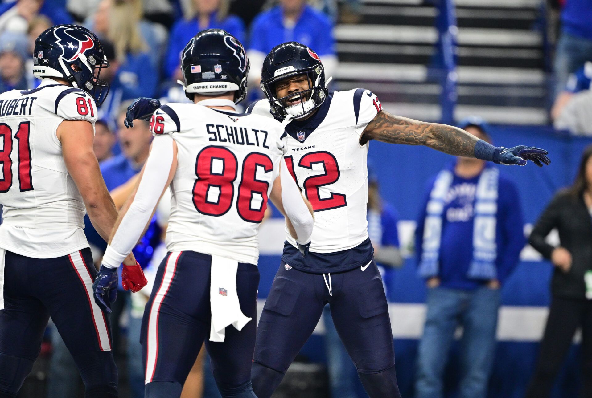 Houston Texans wide receiver Nico Collins (12) celebrates with tight end Dalton Schultz (86) after a touchdown against the Indianapolis Colts during the first quarter at Lucas Oil Stadium.