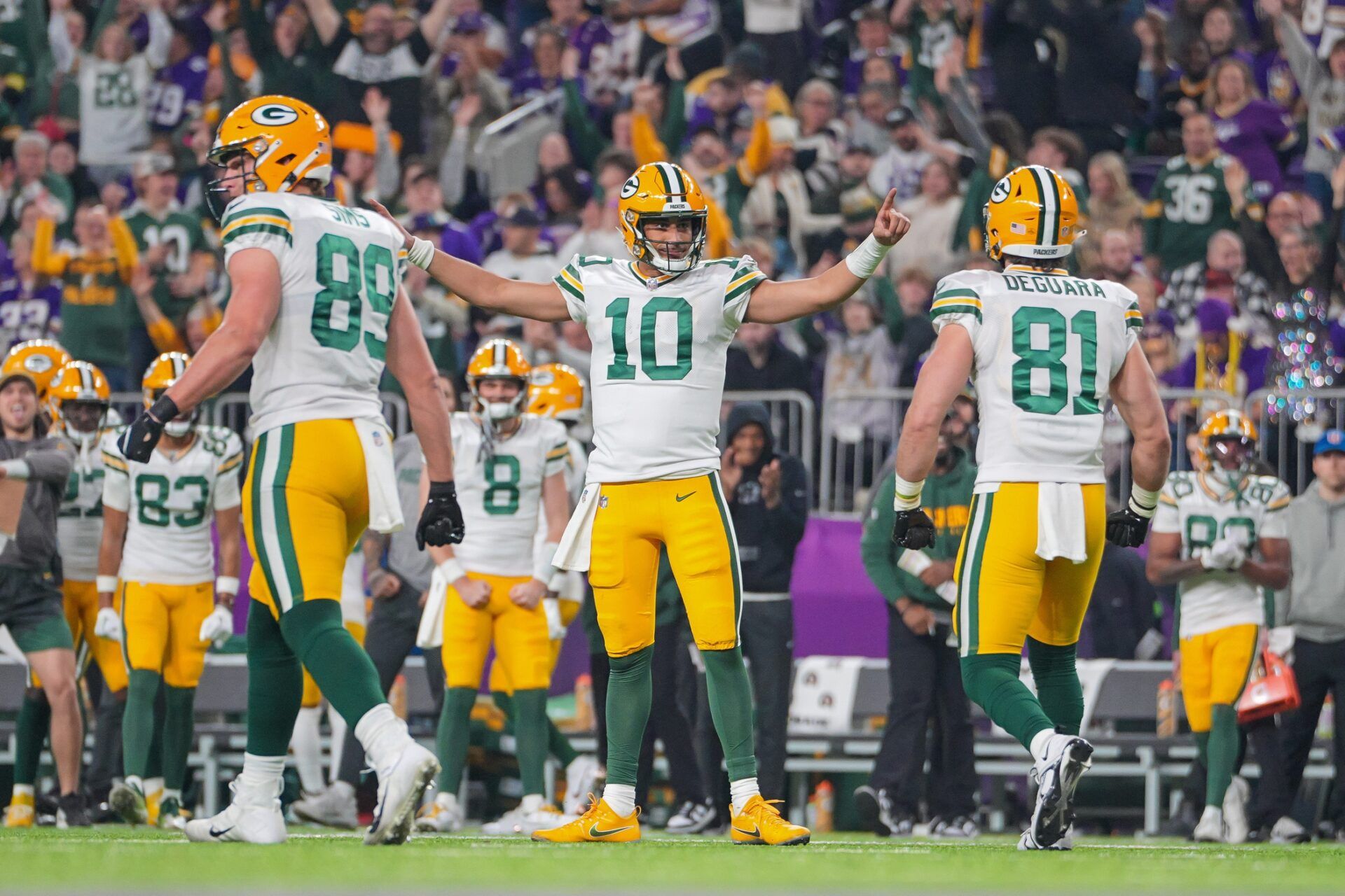 Green Bay Packers quarterback Jordan Love (10) celebrates his touchdown against the Minnesota Vikings in the second quarter at U.S. Bank Stadium. Mandatory Credit: Brad Rempel-USA TODAY Sports