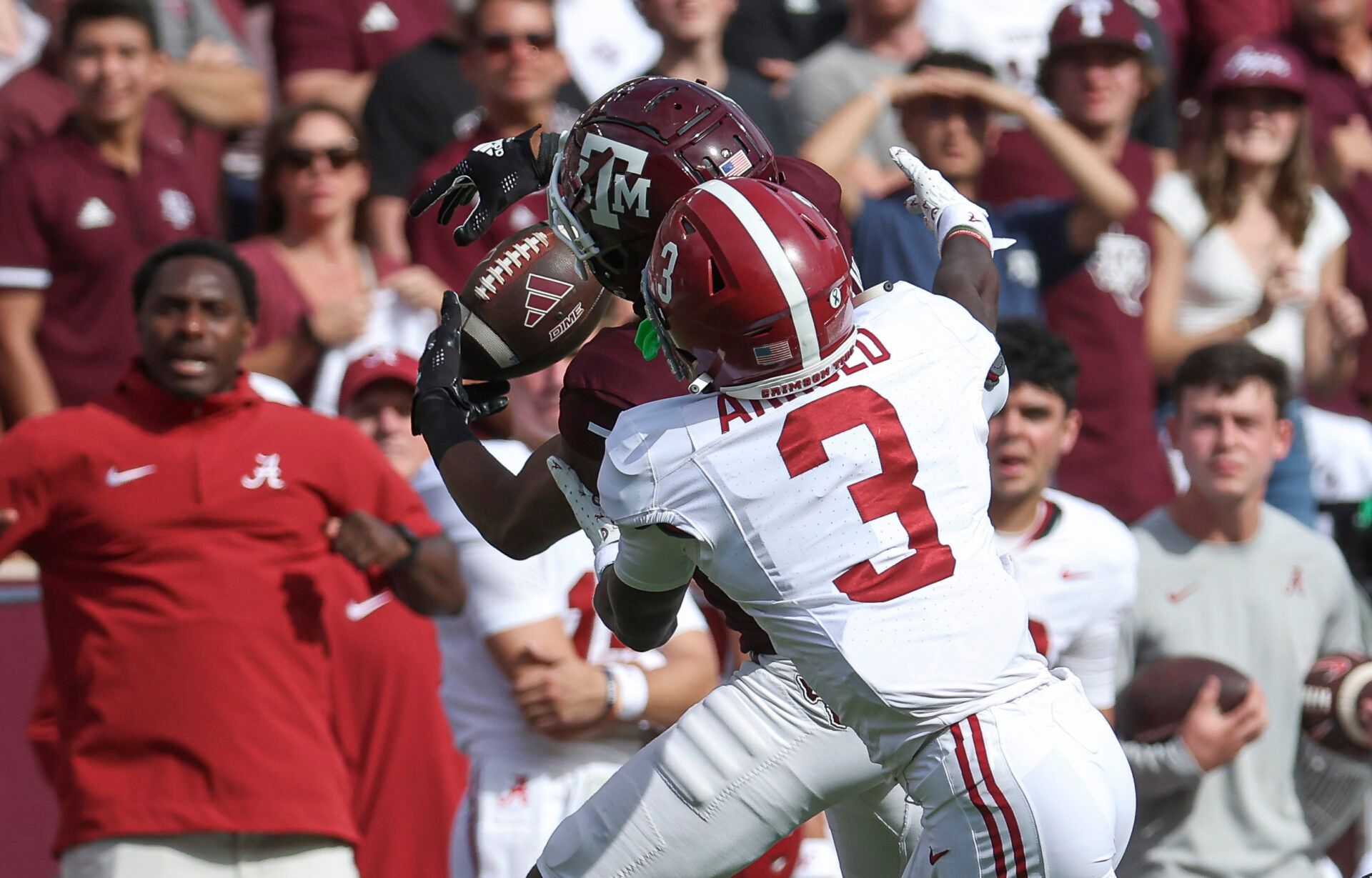 Texas A&M Aggies wide receiver Moose Muhammad III (7) attempts to make a reception as Alabama Crimson Tide defensive back Terrion Arnold (3) /defends during the second quarter at Kyle Field.