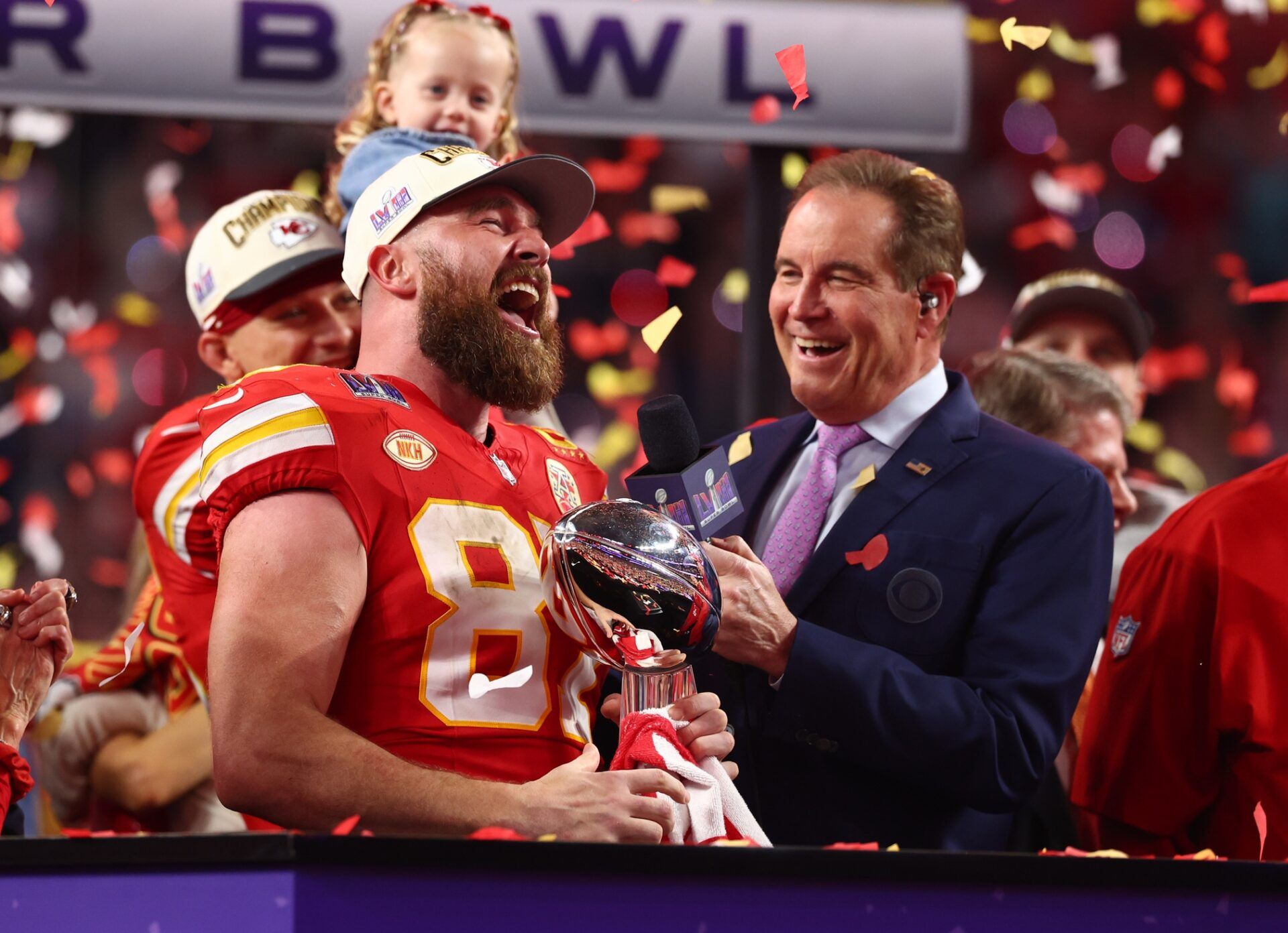 Kansas City Chiefs tight end Travis Kelce (87) celebrates with the Vince Lombardi Trophy after defeating the San Francisco 49ers in Super Bowl LVIII at Allegiant Stadium.