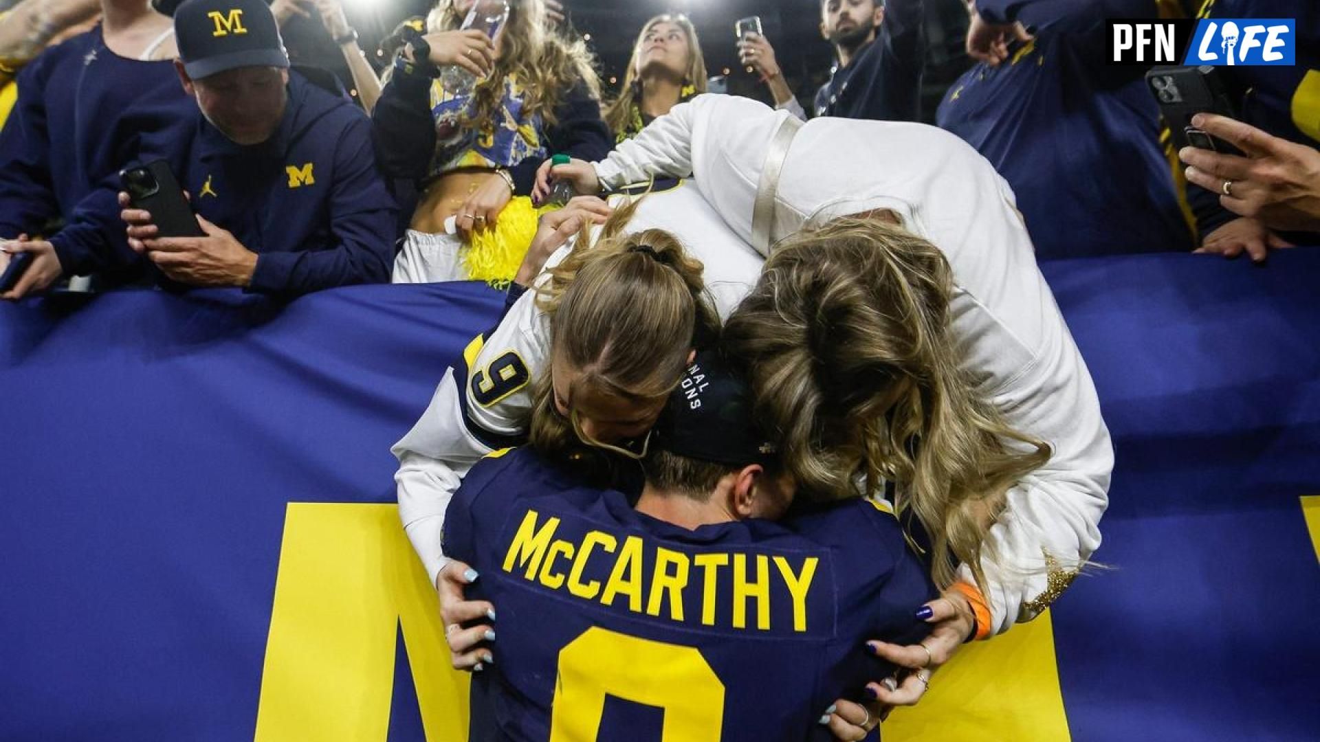 Michigan quarterback J.J. McCarthy celebrates with family after the Wolverines' 34-13 victory over Washington to win the national championship at NRG Stadium in Houston on Monday, Jan. 8, 2024.