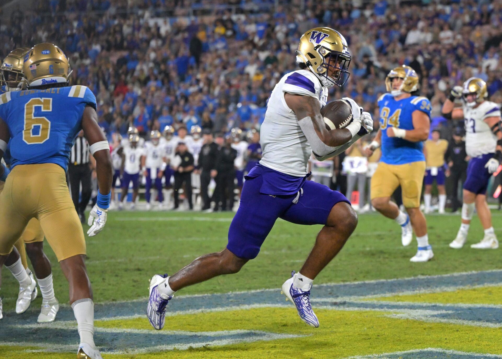 Sep 30, 2022; Pasadena, California, USA; Washington Huskies wide receiver Ja'Lynn Polk (2) runs into the end zone for a touchdown in the second half against the UCLA Bruins at the Rose Bowl. Mandatory Credit: Jayne Kamin-Oncea-USA TODAY Sports