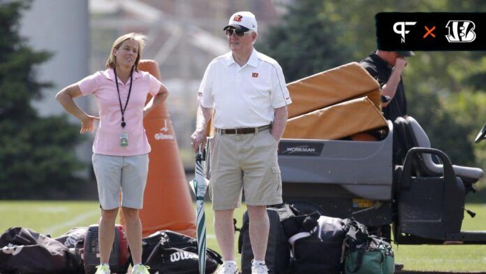 Katie Blackburn, Bengals executive vice president, left, talks with scouting consultant Bill Tobin, during rookie camp in 2015.