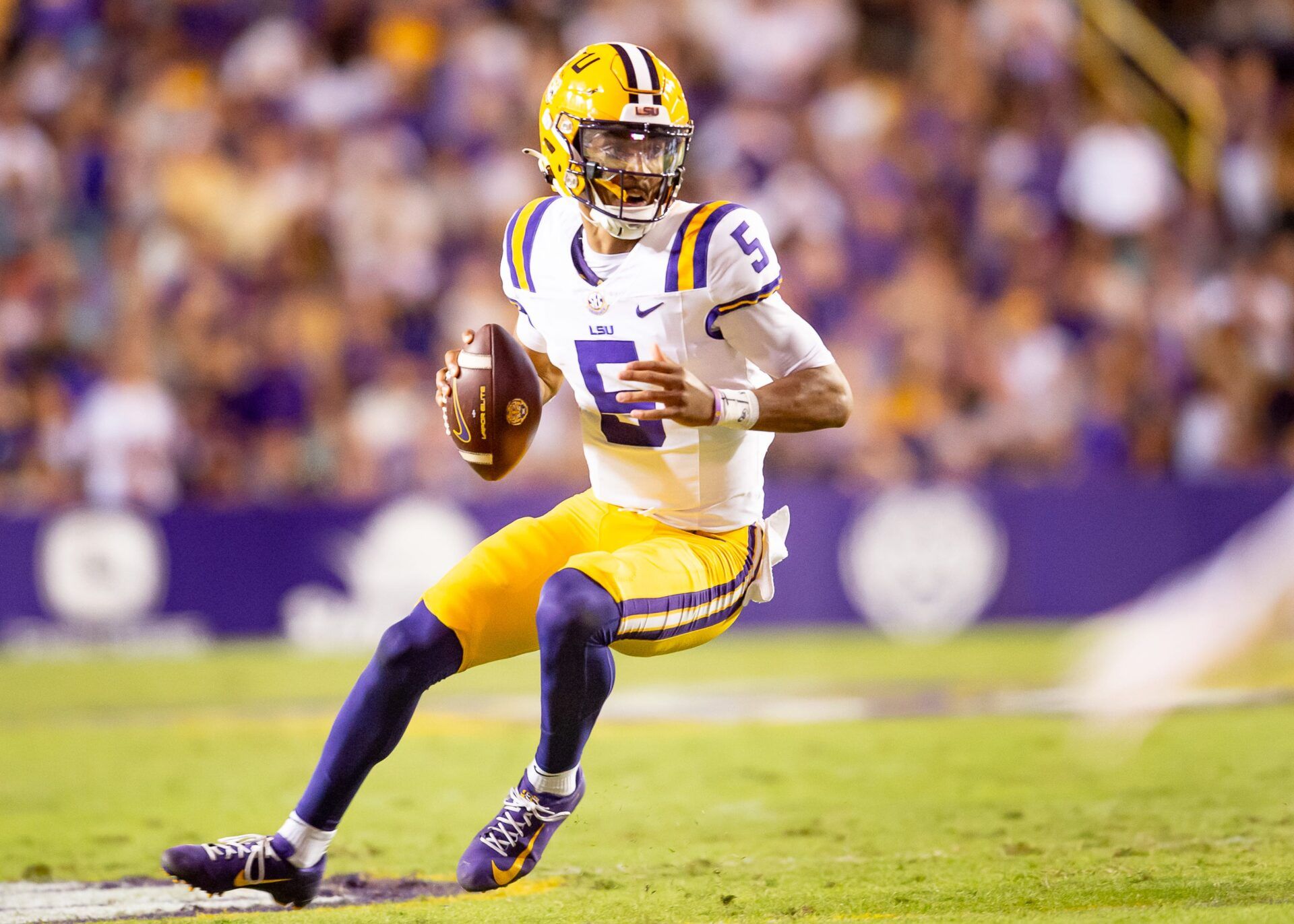 Tigers Quarterback Jayden Daniels 5 runs the ball as the LSU Tigers take on the Auburn Tigers at Tiger Stadium in Baton Rouge, Louisiana, Saturday, Oct. 14, 2023.