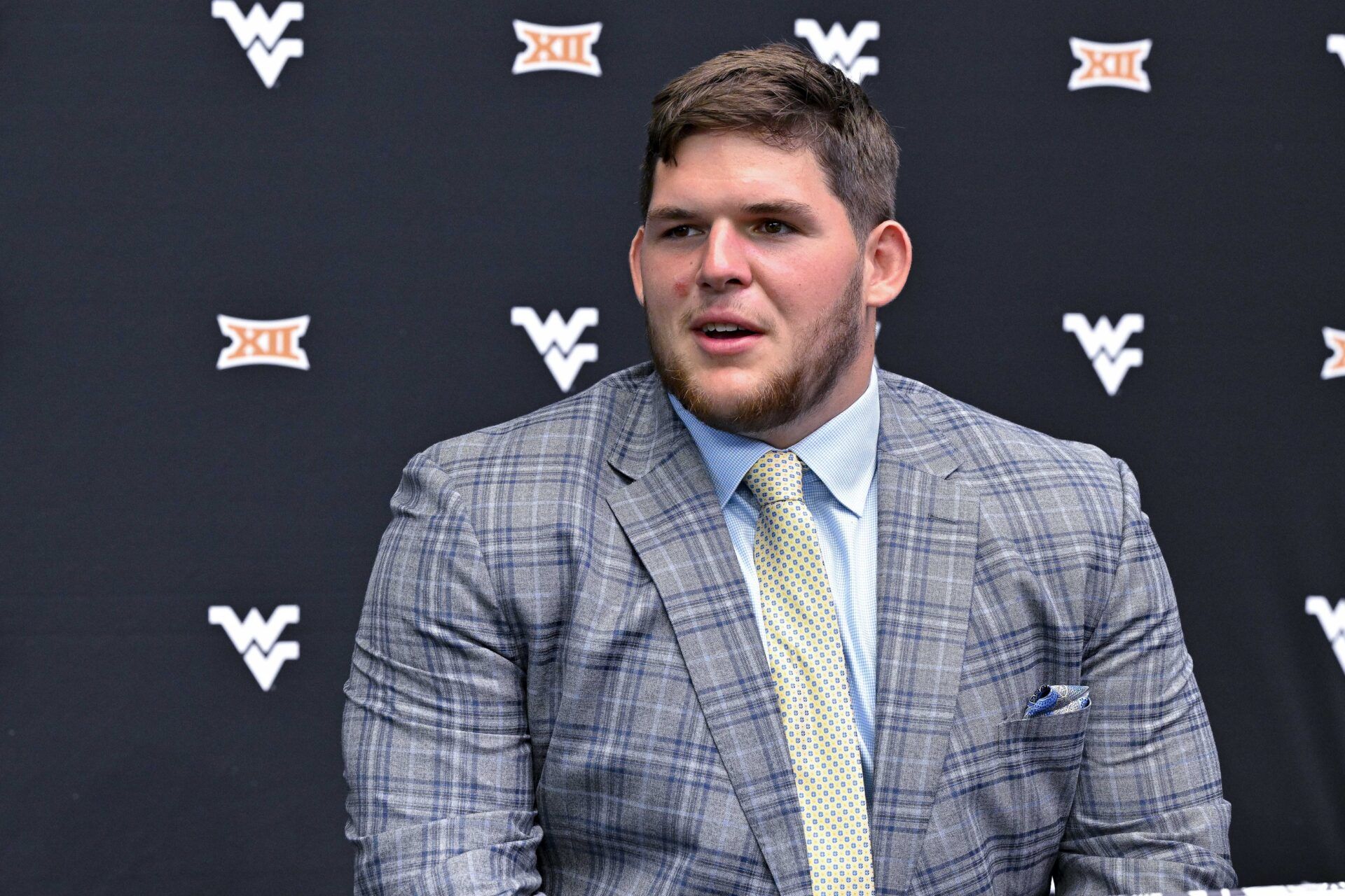 Jul 13, 2023; Arlington, TX, USA; West Virginia Mountaineers offensive lineman Zach Frazier is interviewed during the Big 12 football media day at AT&T Stadium. Mandatory Credit: Jerome Miron-USA TODAY Sports