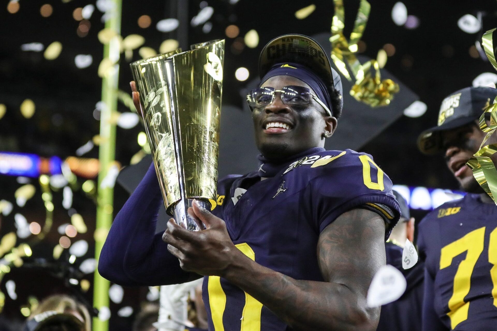 Michigan defensive back Mike Sainristil (0) celebrates the Wolverines' 34-13 win over Washington at the national championship game at NRG Stadium in Houston on Monday, Jan. 8, 2024.