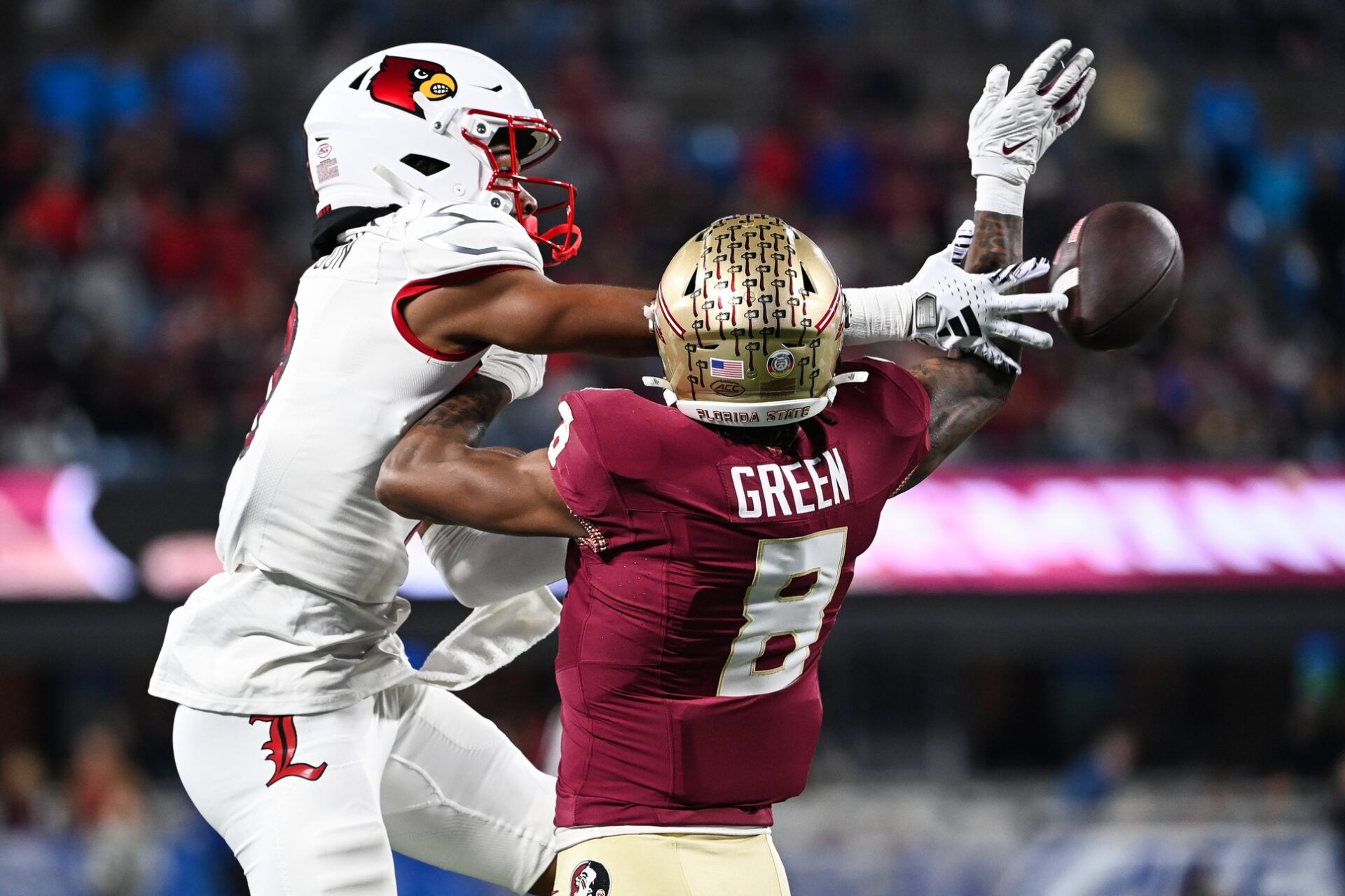 Florida State Seminoles defensive back Renardo Green (8) breaks up a pass intended for Louisville Cardinals wide receiver Jadon Thompson (2) in the third quarter at Bank of America Stadium. Mandatory Credit: Bob Donnan-USA TODAY Sports