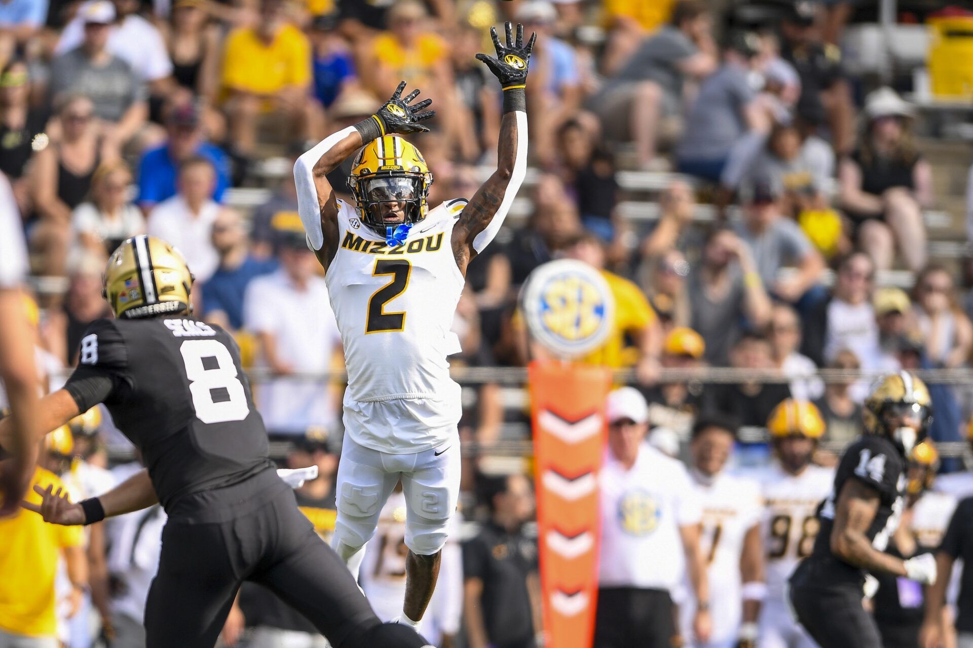 Vanderbilt Commodores quarterback Ken Seals (8) throws a pass over the arms of Missouri Tigers defensive back Ennis Rakestraw Jr. (2) during the first half at FirstBank Stadium. Mandatory Credit: Steve Roberts-USA TODAY Sports