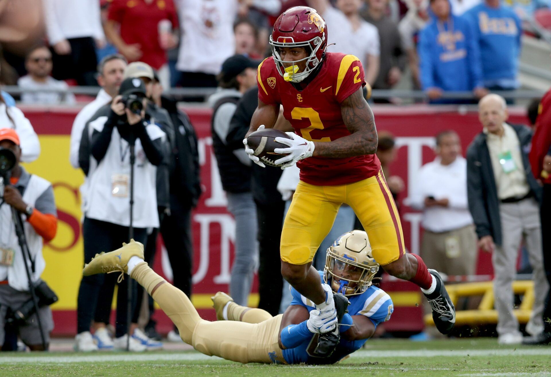 USC Trojans WR Brenden Rice (2) runs after the catch against the UCLA Bruins.