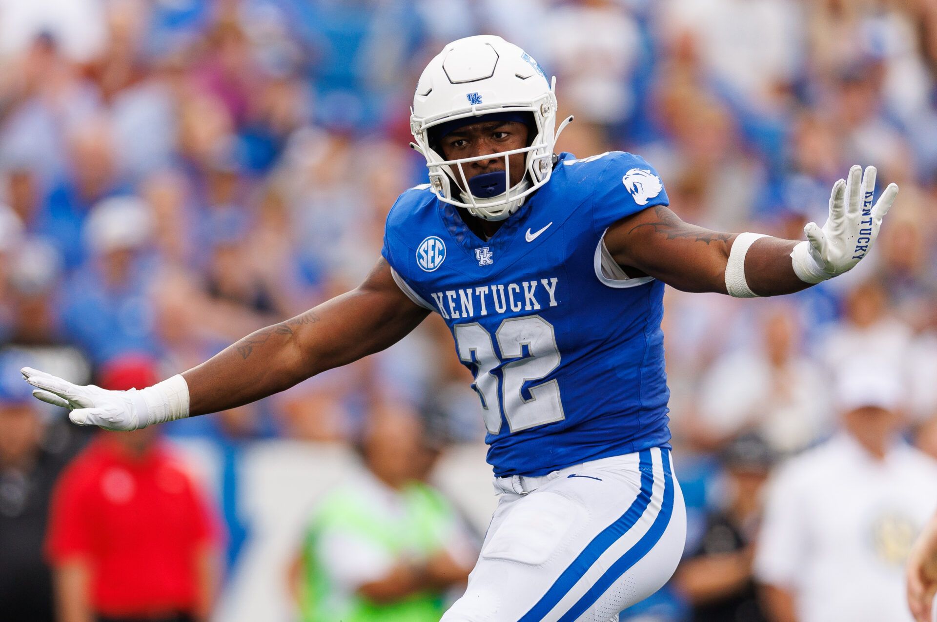 Kentucky Wildcats linebacker Trevin Wallace (32) celebrates a stop during the second quarter against the Eastern Kentucky Colonels at Kroger Field.