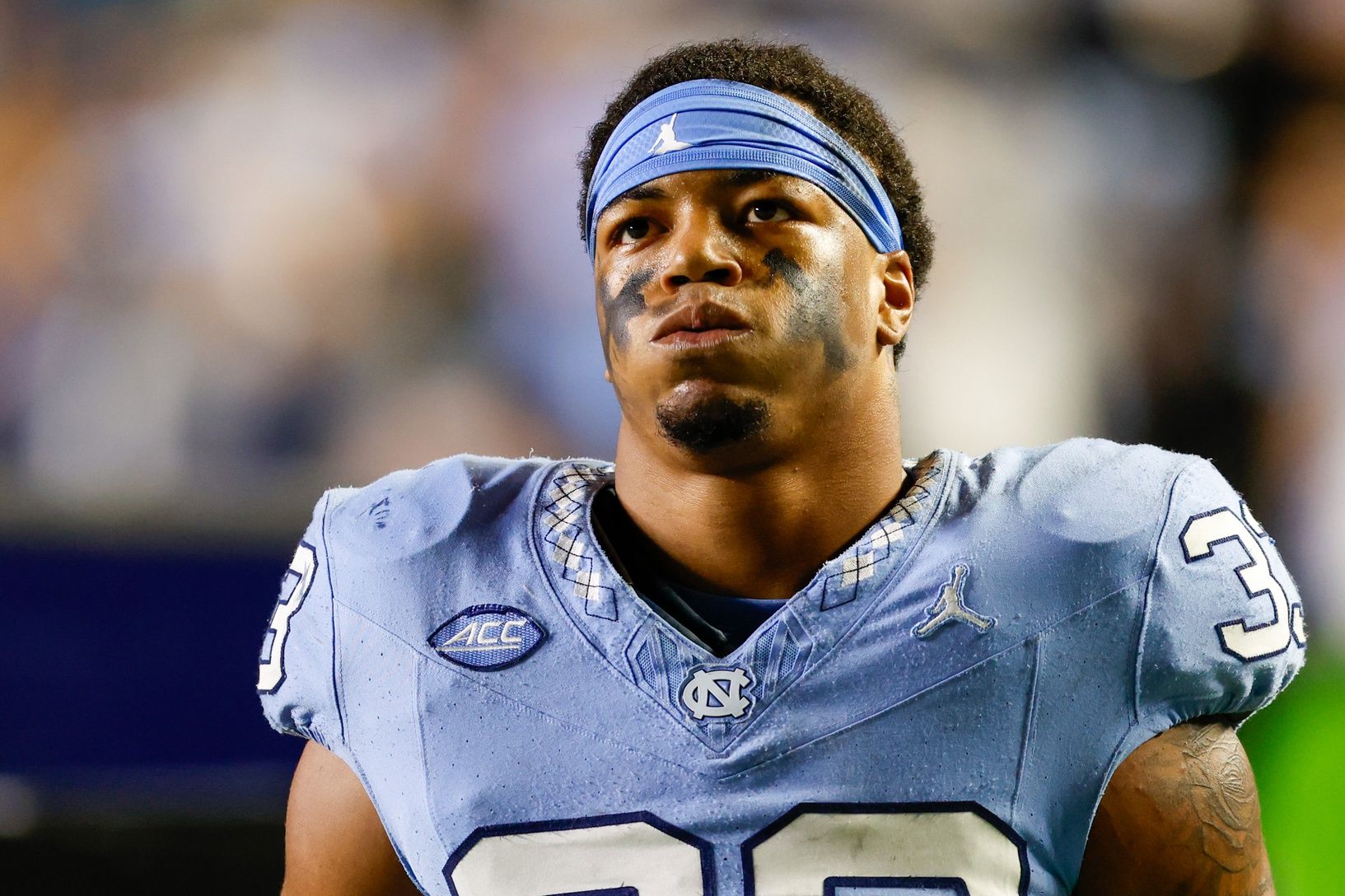 North Carolina Tar Heels linebacker Cedric Gray (33) stands on the sidelines during a game against the Virginia Cavaliers at Kenan Memorial Stadium.