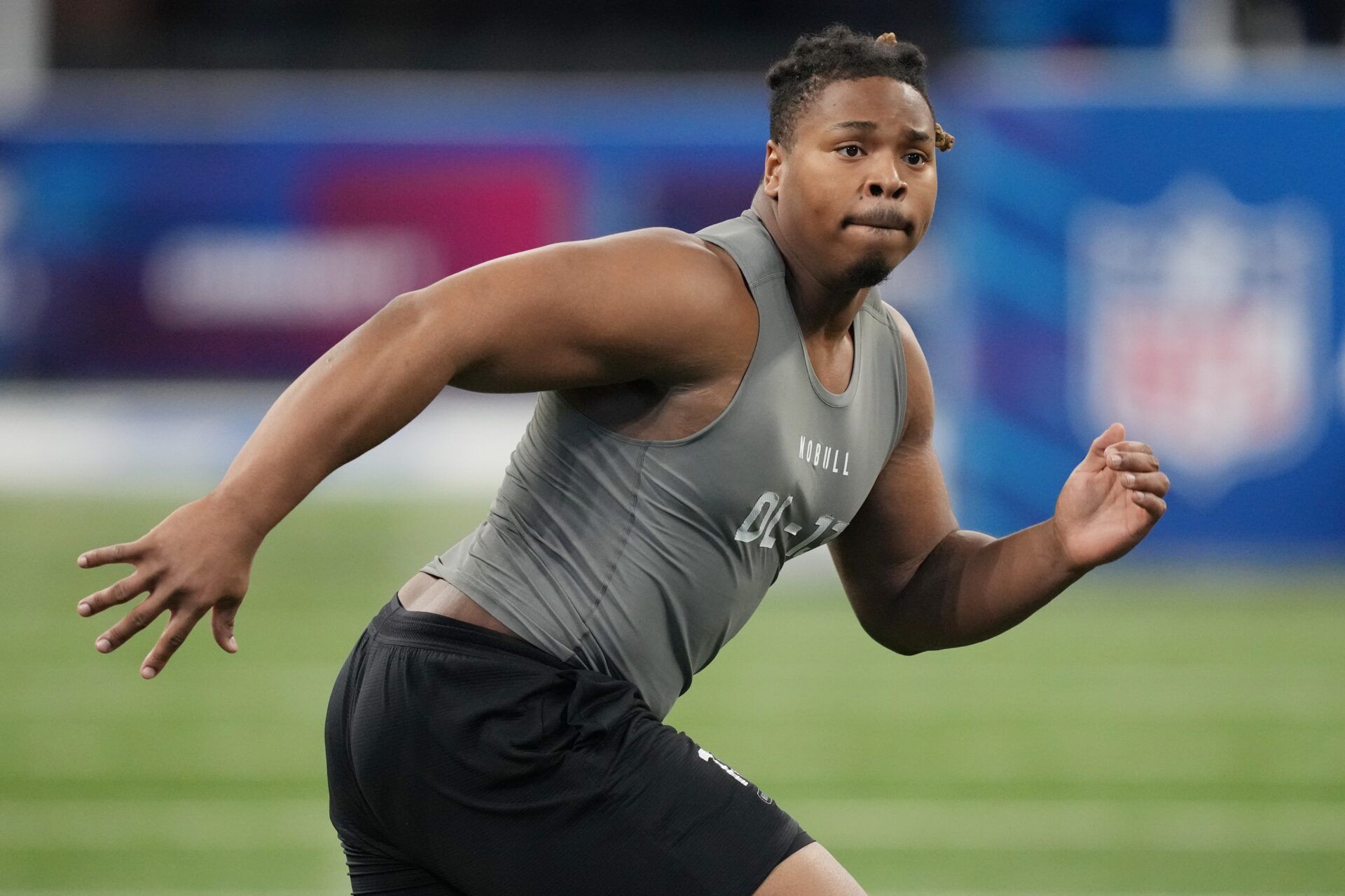 Michigan Wolverines DL Kris Jenkins performs drills at the NFL Scouting Combine.