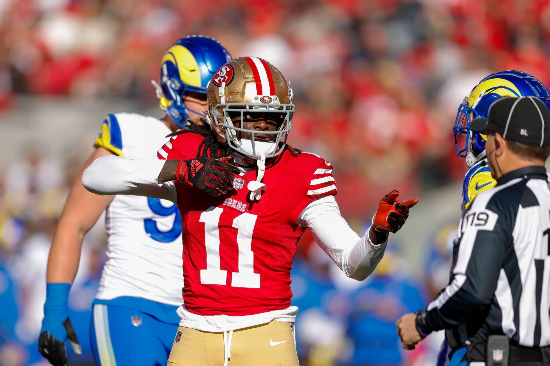 San Francisco 49ers wide receiver Brandon Aiyuk (11) celebrates after a play against the Los Angeles Rams during the first quarter at Levi's Stadium. Mandatory Credit: Sergio Estrada-USA TODAY Sports