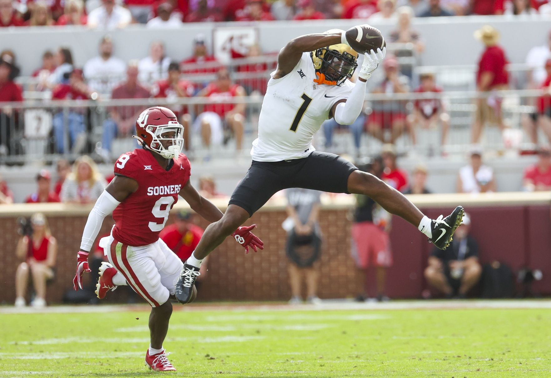 UCF Knights wide receiver Javon Baker (1) makes a catch in fron tof Oklahoma Sooners defensive back Gentry Williams (9) during the second half at Gaylord Family-Oklahoma Memorial Stadium. Mandatory Credit: Kevin Jairaj-USA TODAY Sports