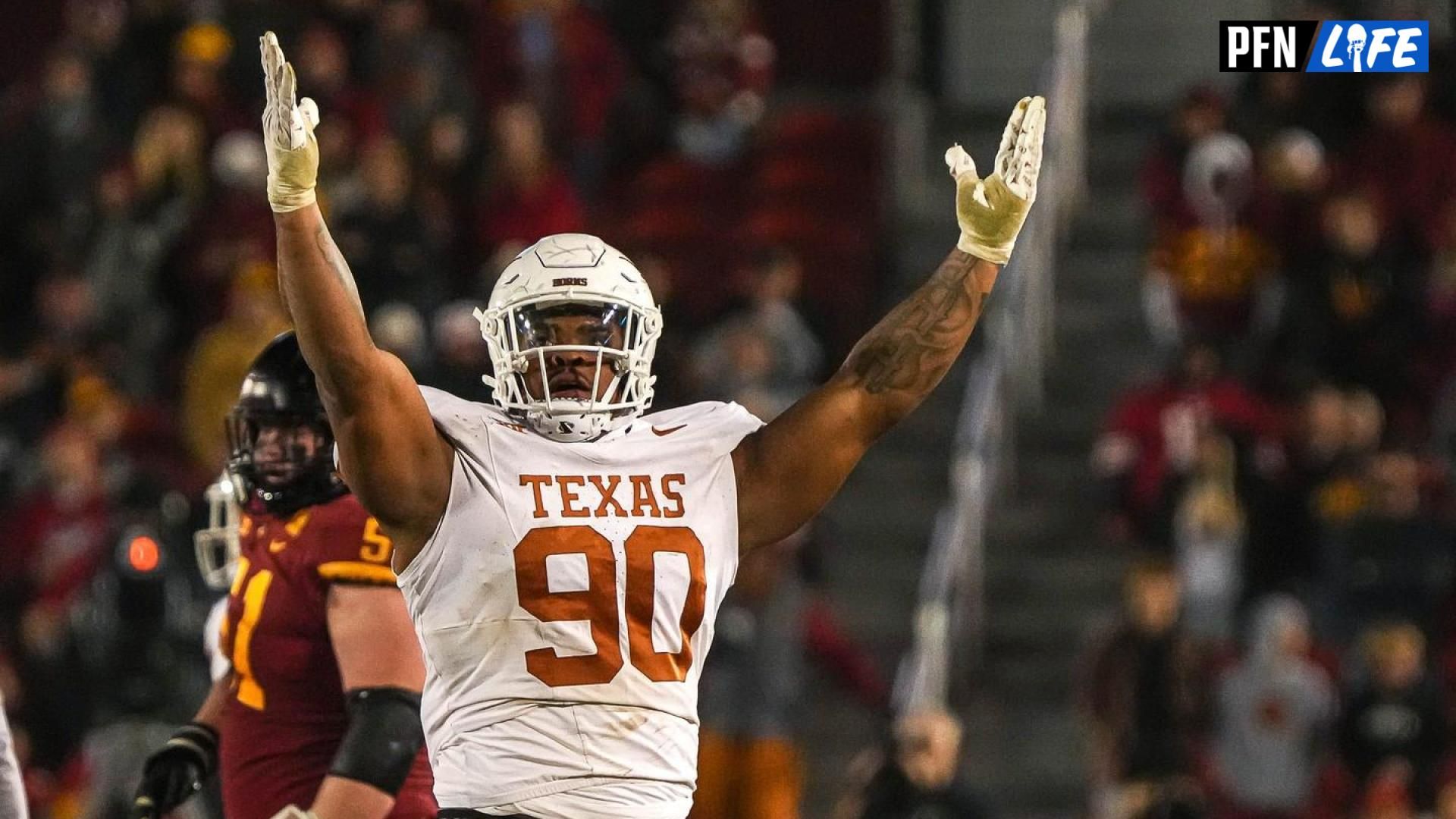 Texas Longhorns defensive lineman Byron Murphy II (90) celebrates sacking Iowa State quarterback Rocco Becht (3) during the game at Jack Trice Stadium on Saturday, Nov. 8, 2023 in Ames, Iowa.