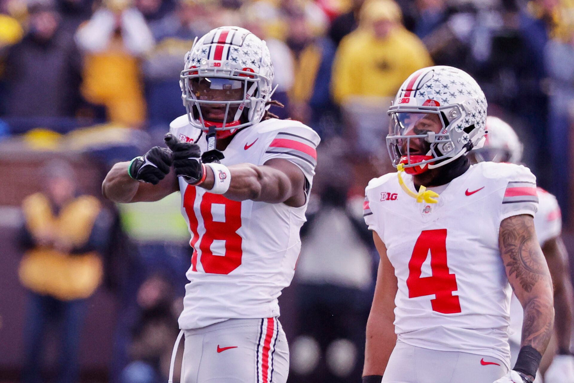 Ohio State Buckeyes wide receiver Marvin Harrison Jr. (18) celebrates a first down in the first half against the Michigan Wolverines at Michigan Stadium.