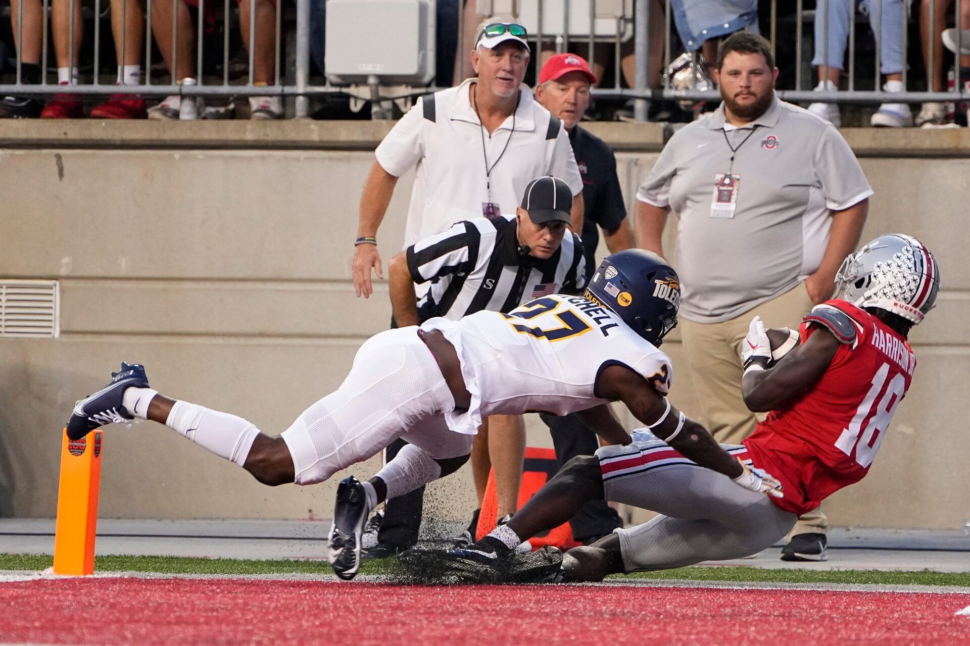 Ohio State Buckeyes wide receiver Marvin Harrison Jr. (18) is hit by Toledo Rockets cornerback Quinyon Mitchell (27) as he catches a touchdown pass during the first half of the NCAA Division I football game at Ohio Stadium.