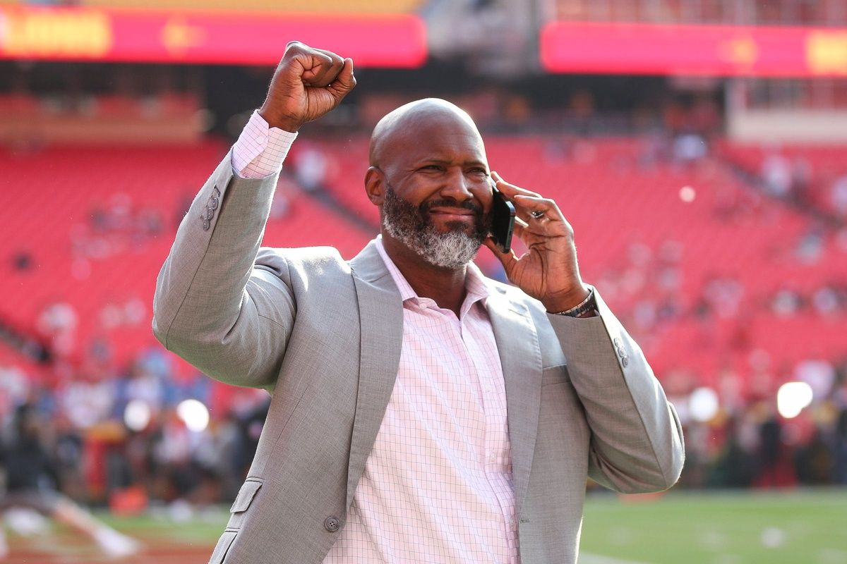 Detroit Lions general manager Brad Holmes shows appreciation for fans as he walks onto the field ahead of the season opener against the Kansas City Chiefs at Arrowhead Stadium in Kansas City, Mo. on Thursday, Sept. 7, 2023.