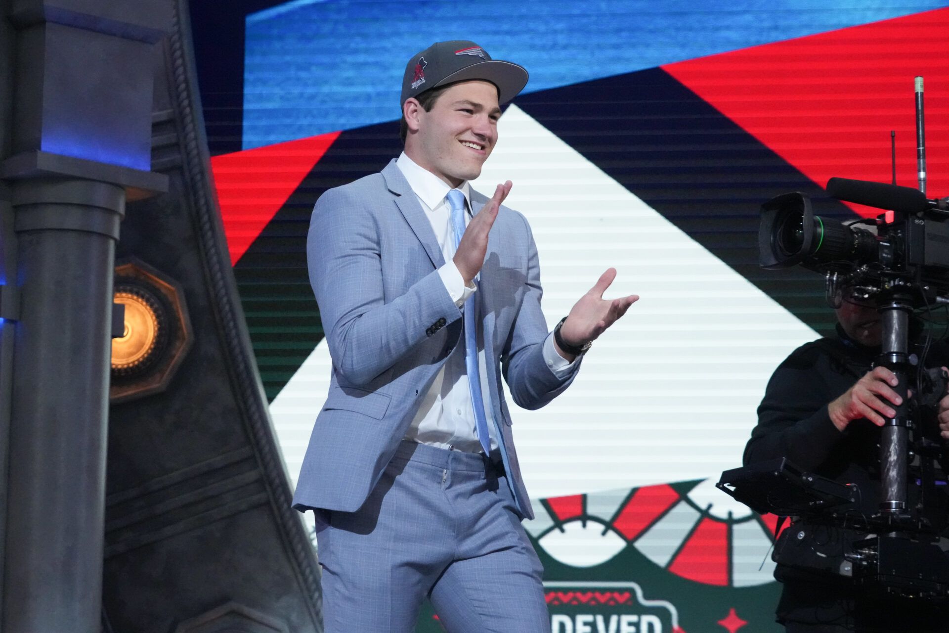 North Carolina Tar Heels quarterback Drake Maye reacts after being selected by the New England Patriots as the No. 3 pick in the first round of the 2024 NFL Draft at Campus Martius Park and Hart Plaza.