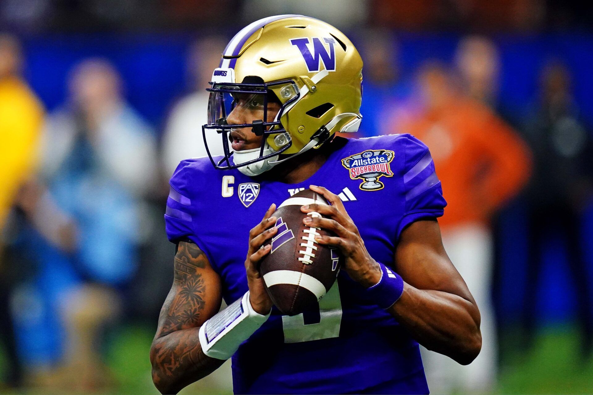 Washington Huskies quarterback Michael Penix Jr. (9) drops back to pass during the first quarter against the Texas Longhorns in the 2024 Sugar Bowl college football playoff semifinal game at Caesars Superdome. Mandatory Credit: John David Mercer-USA TODAY Sports