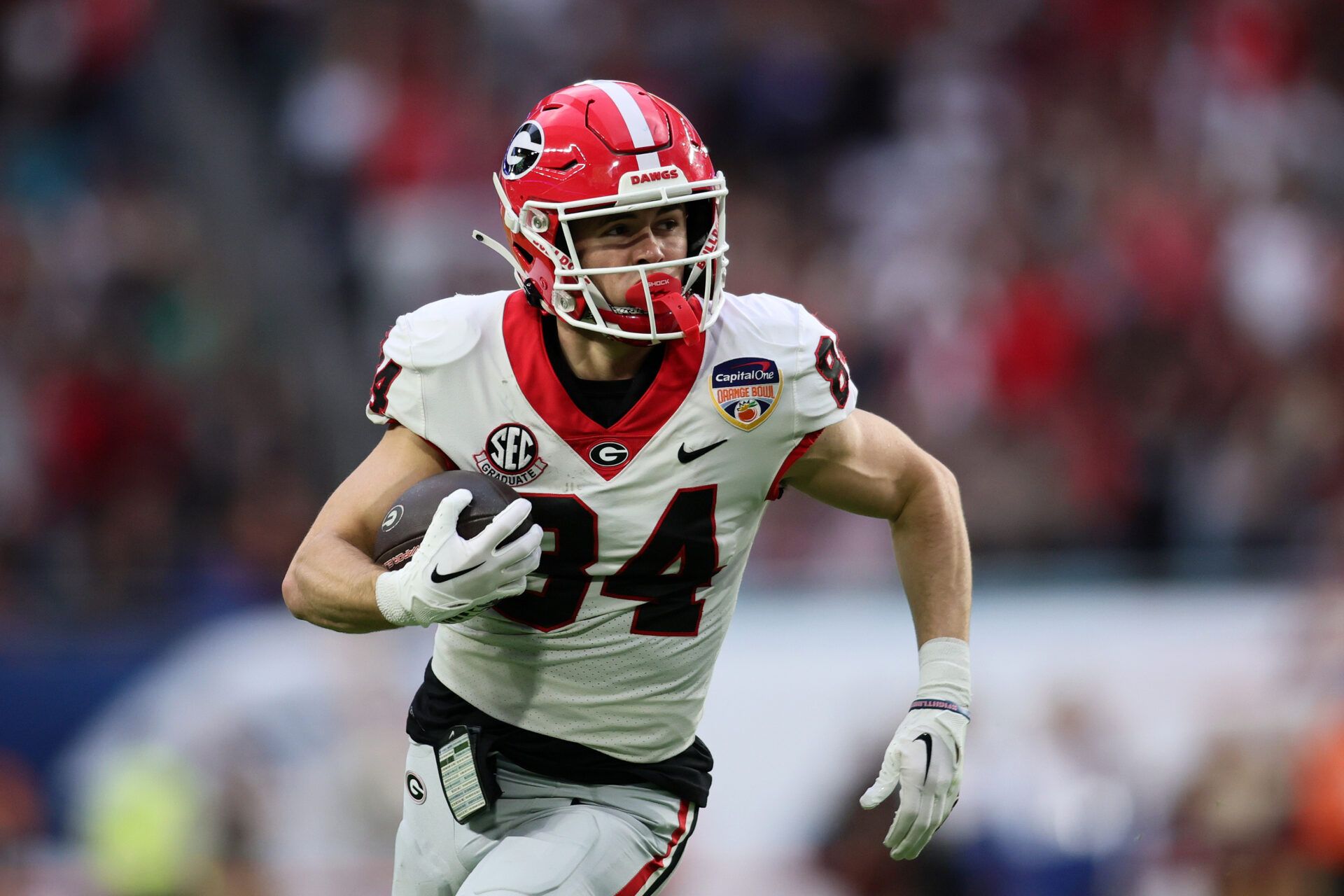 Georgia Bulldogs wide receiver Ladd McConkey (84) makes a catch and runs for touchdown against the Florida State Seminoles during the first half in the 2023 Orange Bowl at Hard Rock Stadium.