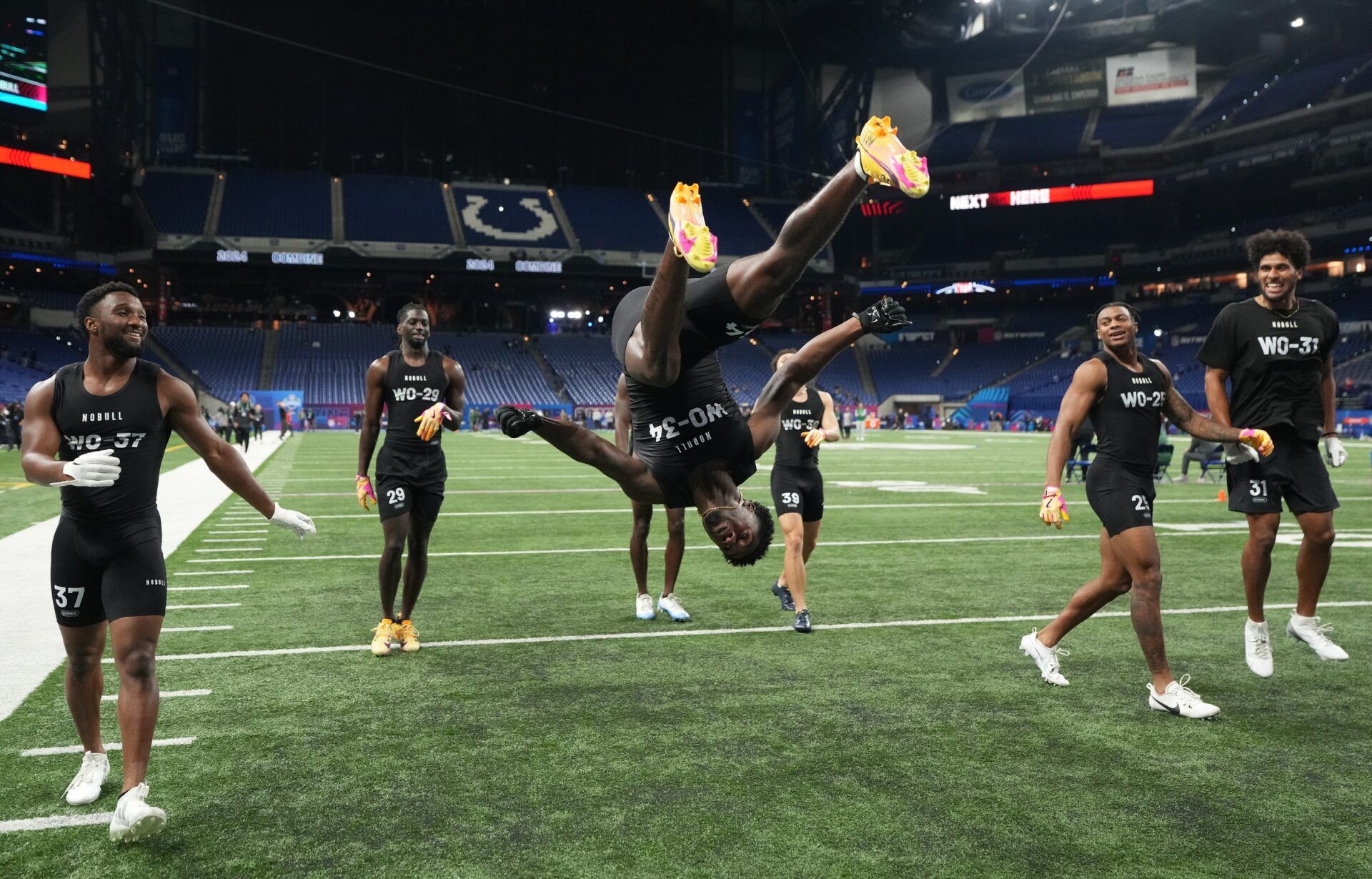 Southern California wide receiver Tahj Washington (WO34) celebrates with a backflip during the 2024 NFL Combine at Lucas Oil Stadium.