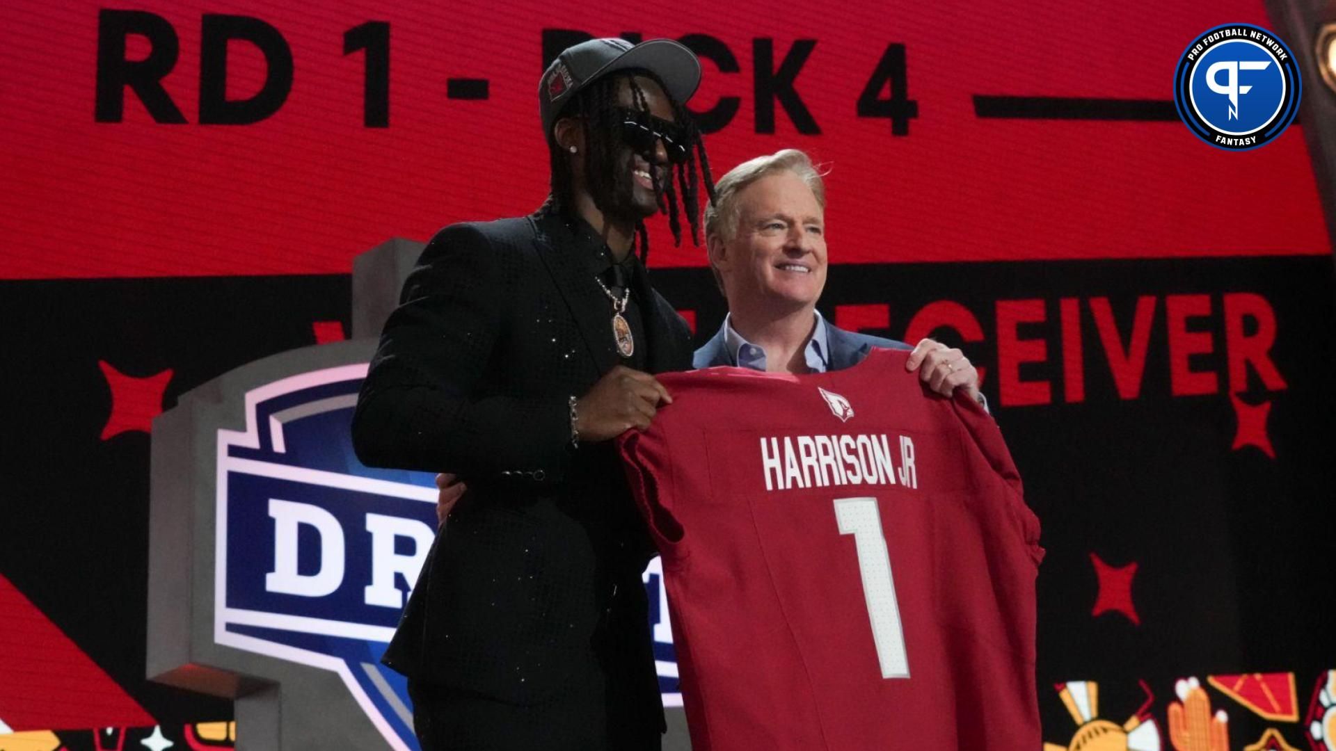 Ohio State Buckeyes wide receiver Marvin Harrison Jr. poses with NFL commissioner Roger Goodell after being selected by the Arizona Cardinals as the No. 4 pick in the first round of the 2024 NFL Draft at Campus Martius Park and Hart Plaza.