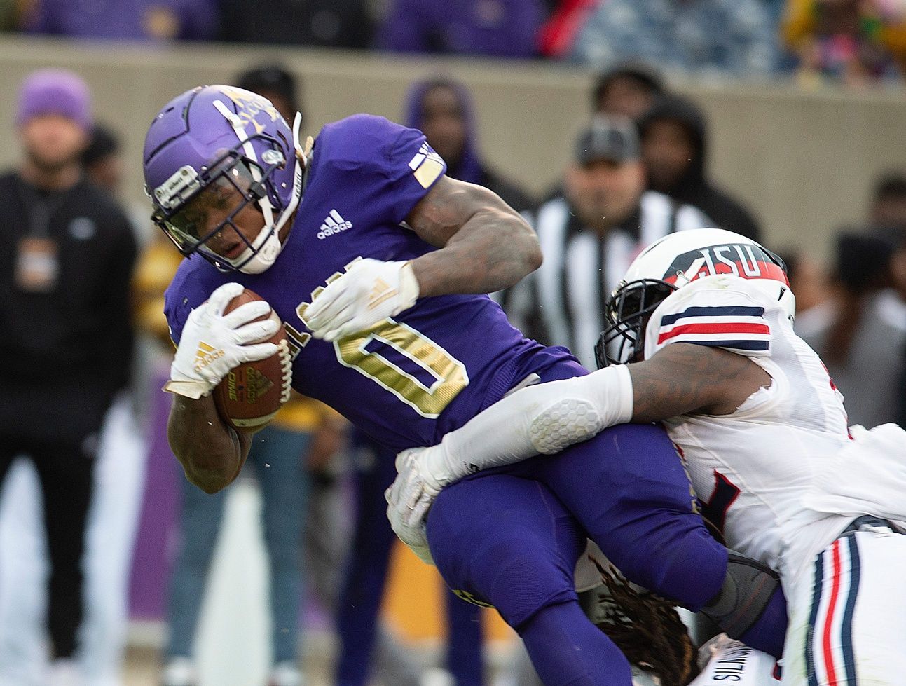 Alcorn State running back Jarveon Howard (0) gets taken down by Jackson State linebacker Jurriente Davis (32) during play at the Jack Spinks Football Stadium in Lorman, Miss., Saturday, Nov. 19, 2022.