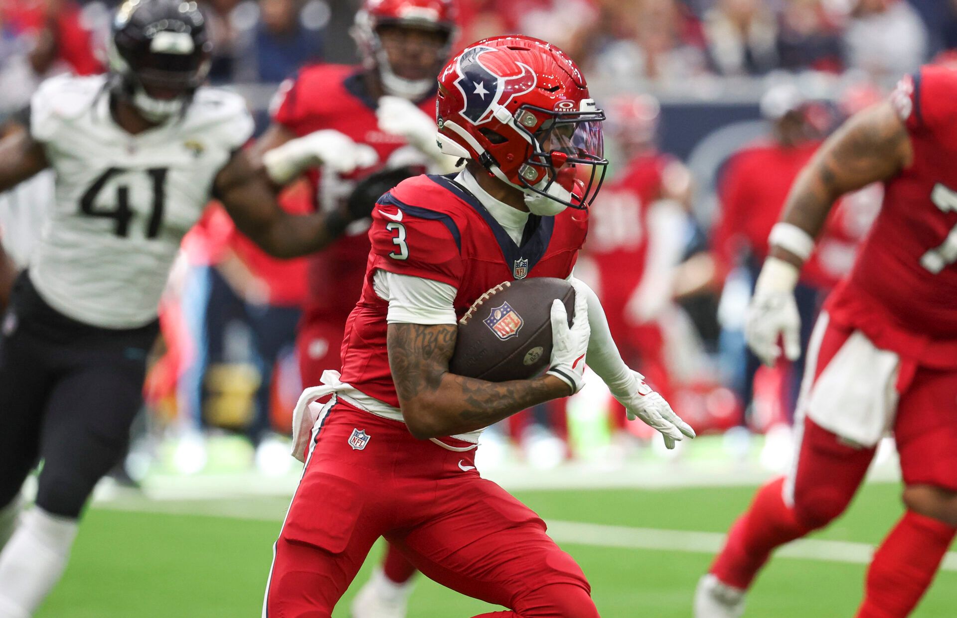 Houston Texans wide receiver Tank Dell (3) runs with the ball during the fourth quarter against the Jacksonville Jaguars at NRG Stadium.