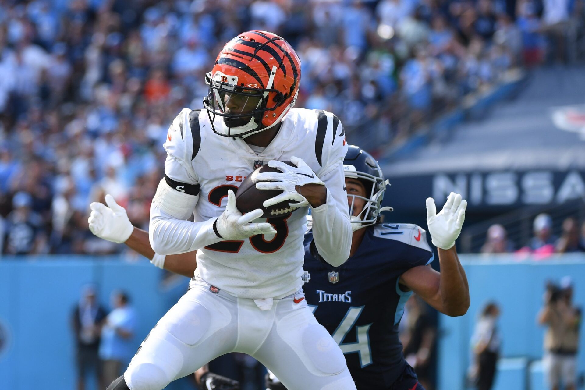 Cincinnati Bengals safety Dax Hill (23) intercepts a pass intended for Tennessee Titans wide receiver Colton Dowell (14) during the second half at Nissan Stadium. Mandatory Credit: Christopher Hanewinckel-USA TODAY Sports