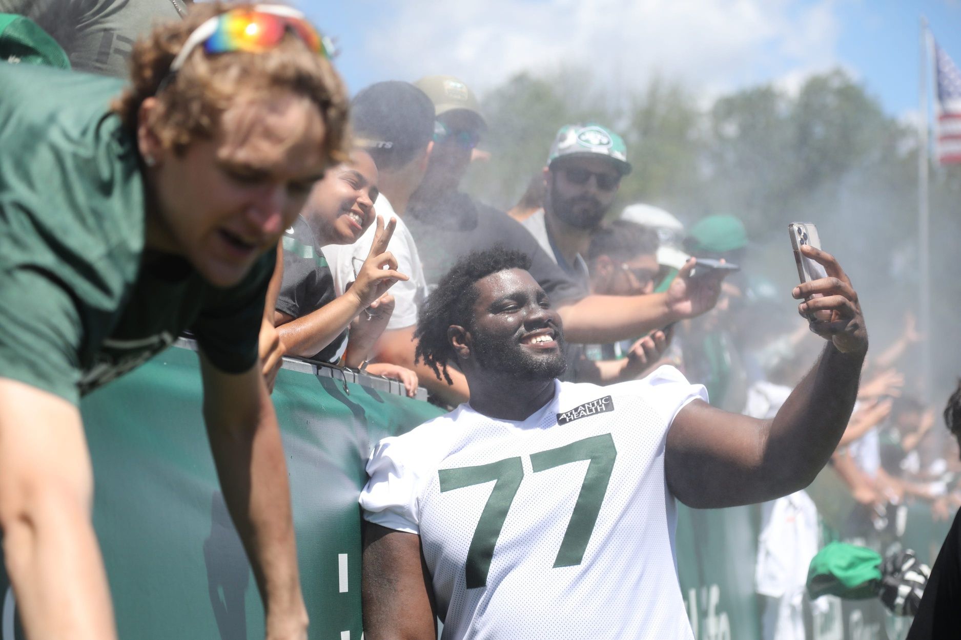 Mekhi Becton signs autographs and takes photos with fans after practice. Jet Fan Fest took place at the 2022 New York Jets Training Camp in Florham Park, NJ on July 30, 2022.
