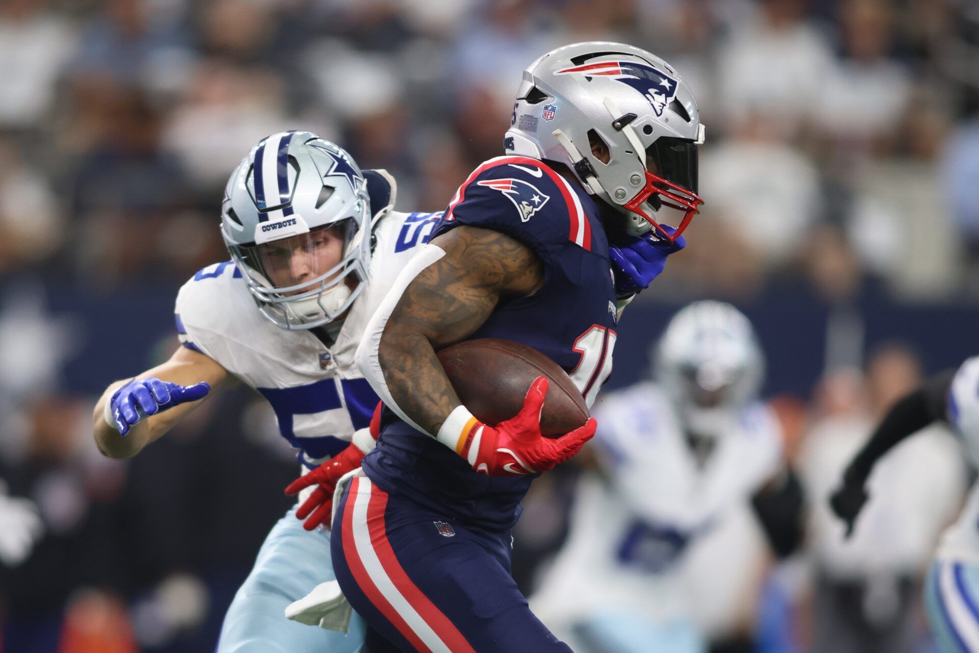 New England Patriots RB Ezekiel Elliott (15) runs with the ball against the Dallas Cowboys.