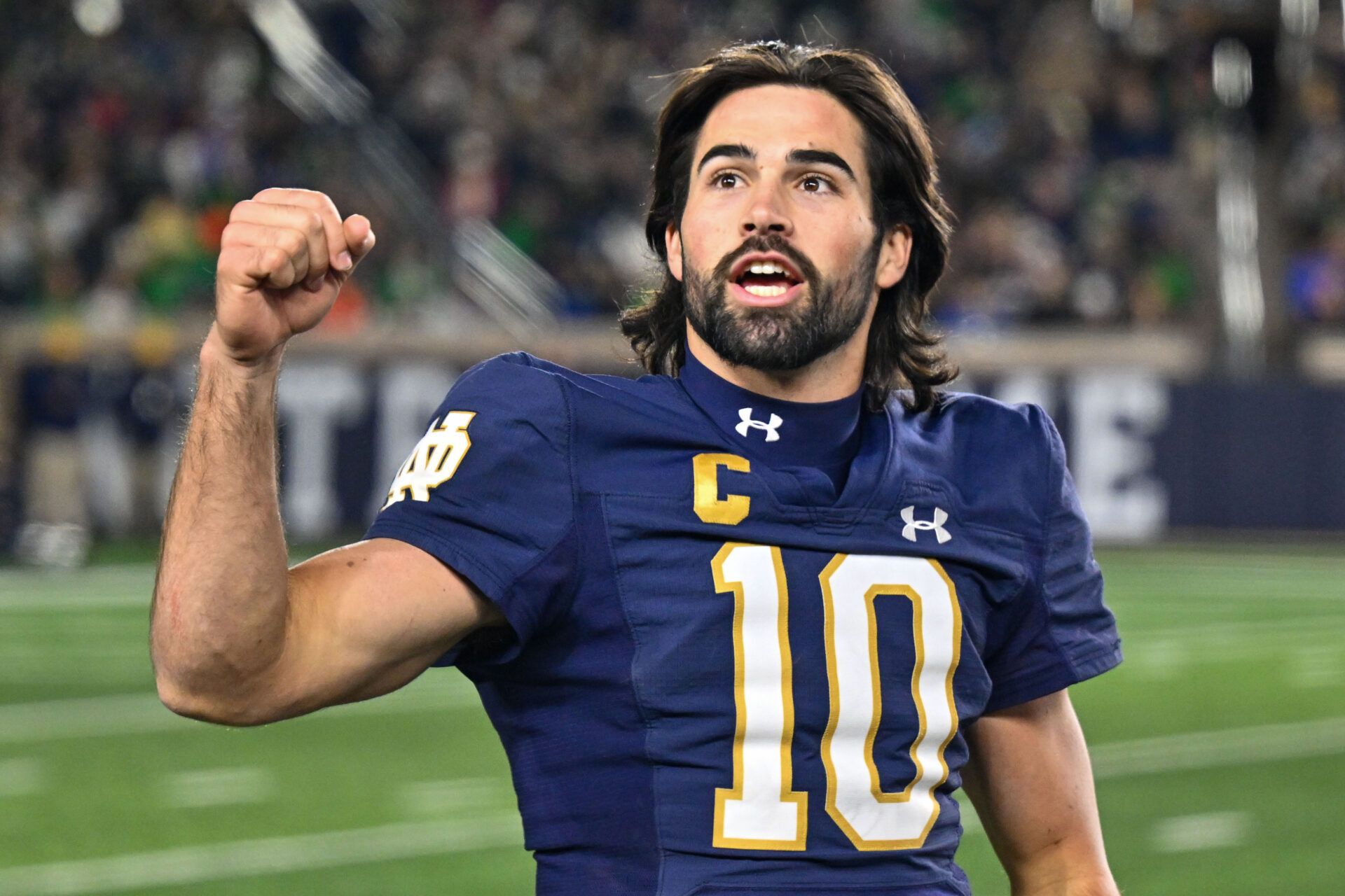 Notre Dame Fighting Irish quarterback Sam Hartman (10) exhorts the crowd in the fourth quarter against the Wake Forest Demon Deacons at Notre Dame Stadium.