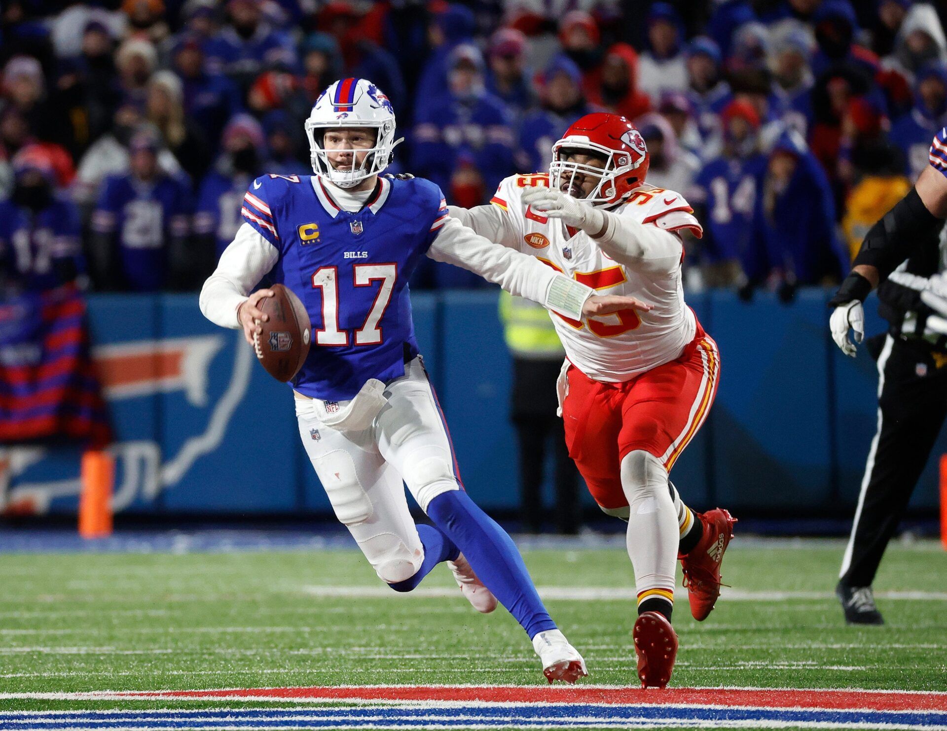 Buffalo Bills quarterback Josh Allen (17) is caught from behind by Kansas City Chiefs defensive tackle Chris Jones (95).